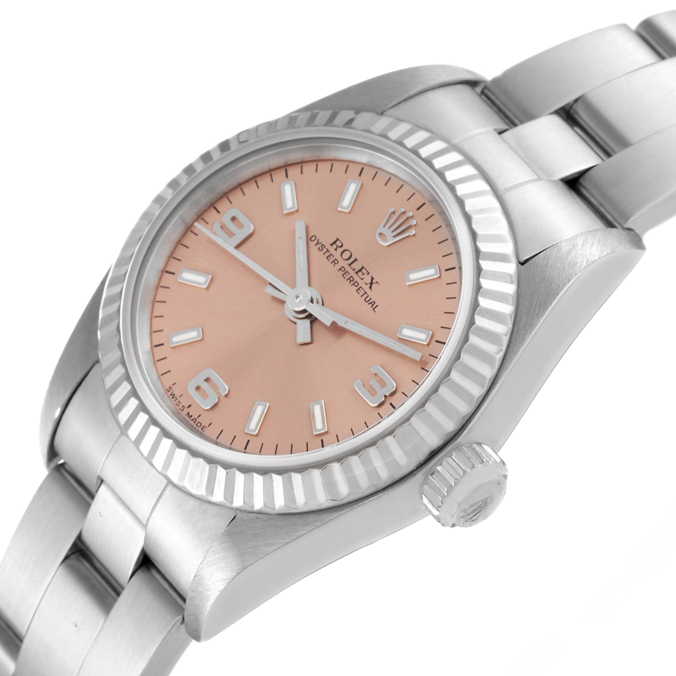 The image shows a side angle of the Rolex Oyster Perpetual 76094 Women
s Stainless Steel Pink Dial 76094 Women
s Stainless Steel Pink Dial watch featuring its dial, bezel, crown, and part of the bracelet.