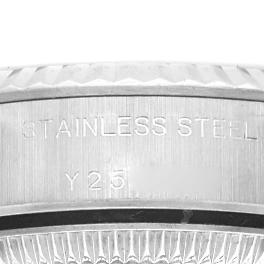 This image shows a close-up of the side view of the case back of a Rolex Oyster Perpetual 76094 Women
s Stainless Steel Pink Dial 76094 Women
s Stainless Steel Pink Dial watch, highlighting the stainless steel engraving.