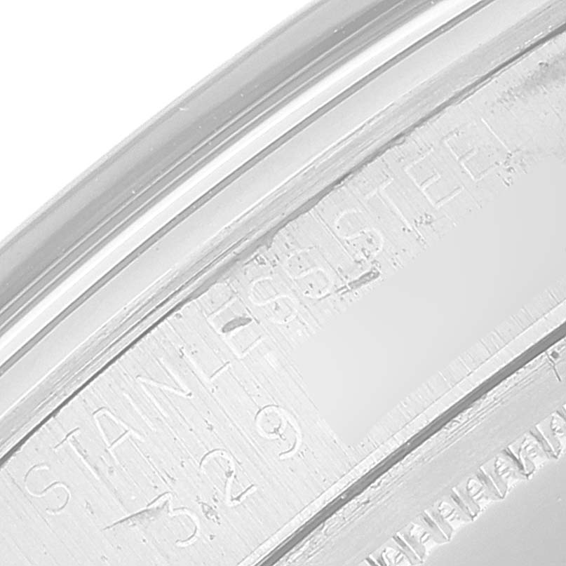 The image shows an angled close-up of the stainless steel casing of the Vintage Collection model by Rolex.