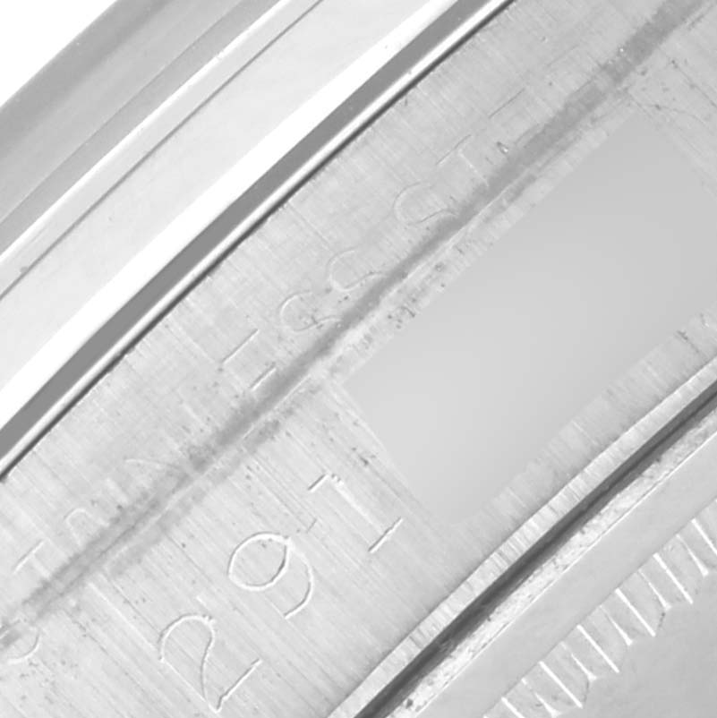 This image shows a close-up of the engraved inner bezel of a Rolex Date 6694 Men's Stainless Steel Silver Dial 6694 Men's Stainless Steel Silver Dial model watch.