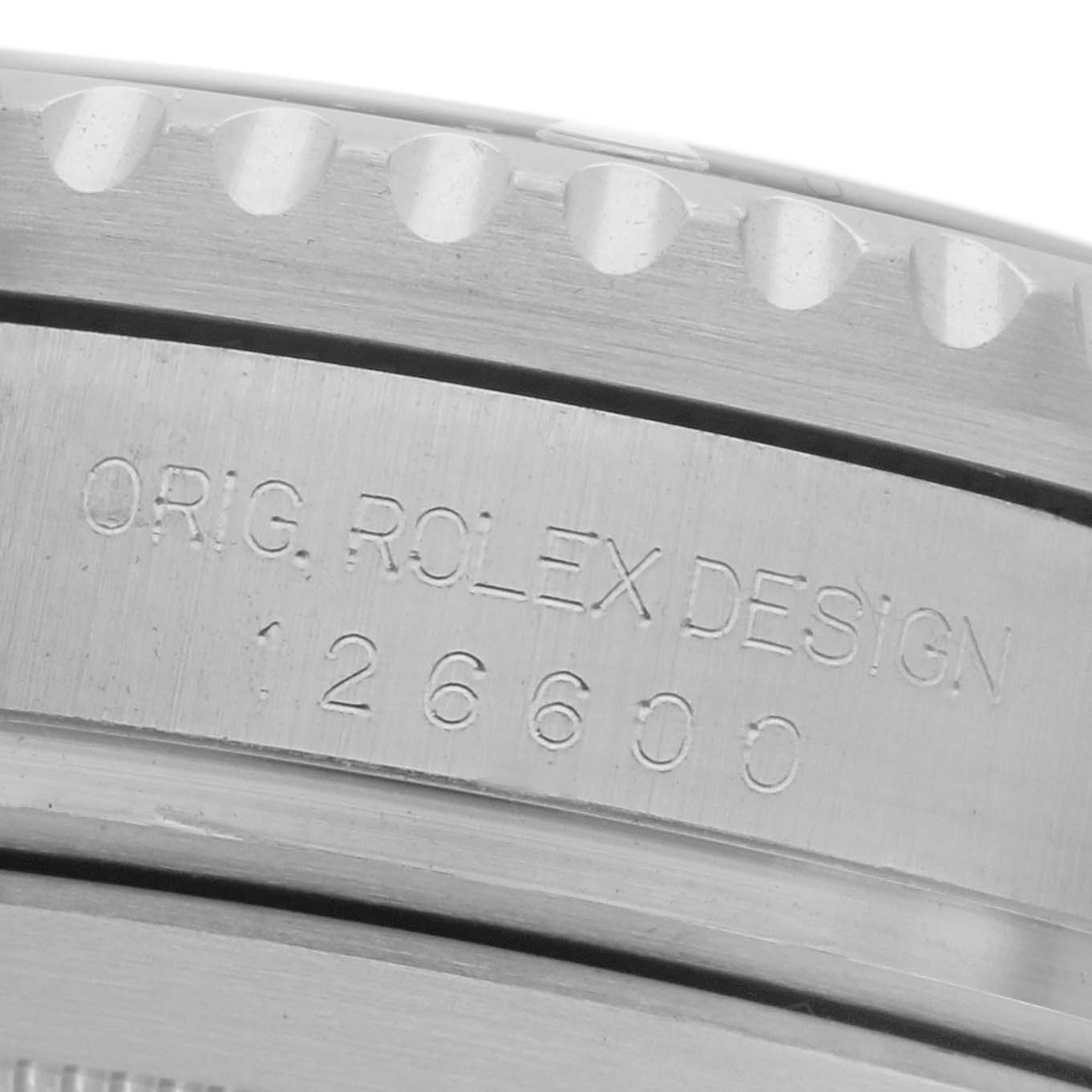 The image shows a close-up of the side engraving on a Rolex Sea-Dweller 126600 Men's Stainless Steel Black Dial 126600 Men's Stainless Steel Black Dial watch, model number 126600.