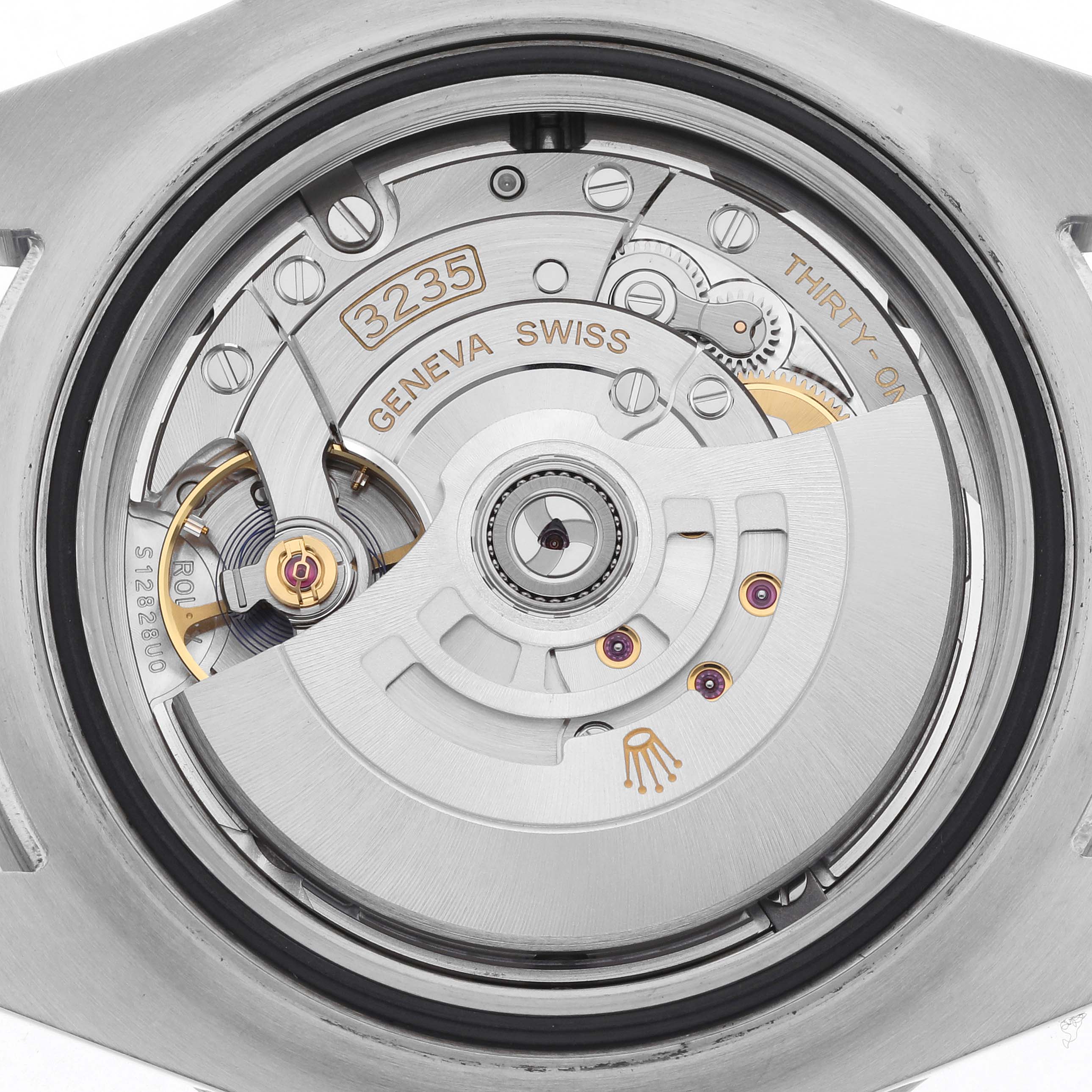 The image shows the movement of a Rolex Sea-Dweller 126600 Men's Stainless Steel Black Dial 126600 Men's Stainless Steel Black Dial watch from the back, featuring intricate gears and the rotor.