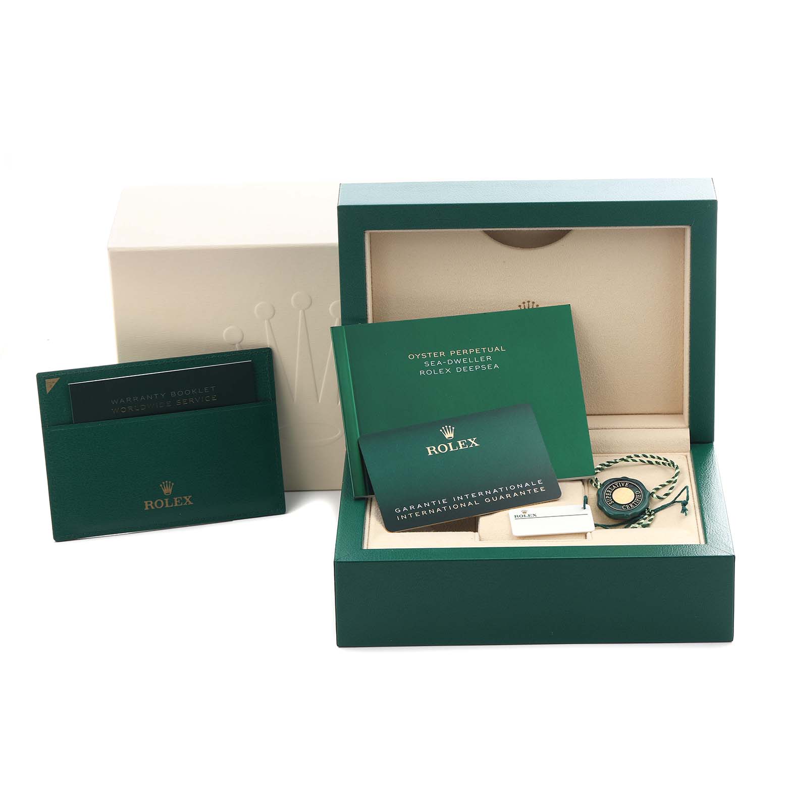 The image shows a Rolex Sea-Dweller 126600 Men's Stainless Steel Black Dial 126600 Men's Stainless Steel Black Dial box with its accessories, including booklets and a tag, all from a top angle.