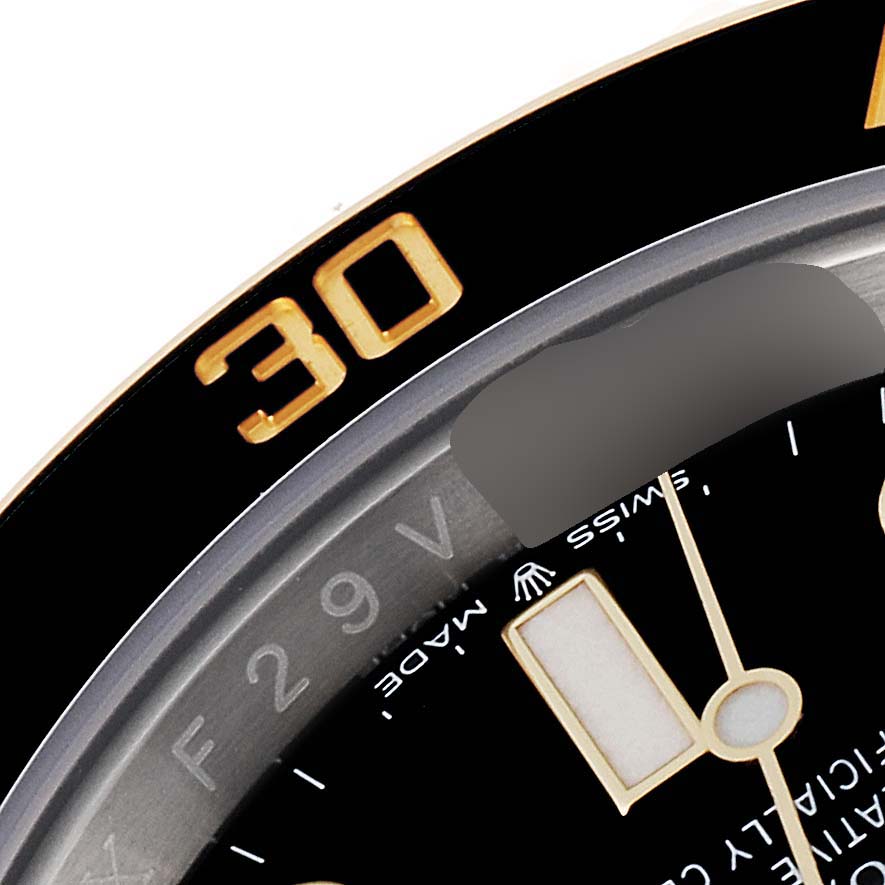 The image shows a close-up of the bezel and part of the dial of a Rolex Submariner 126613 Men's Steel and Gold (two tone) Black Dial 126613 Men's Steel and Gold (two tone) Black Dial watch, highlighting the 30-minute marker.