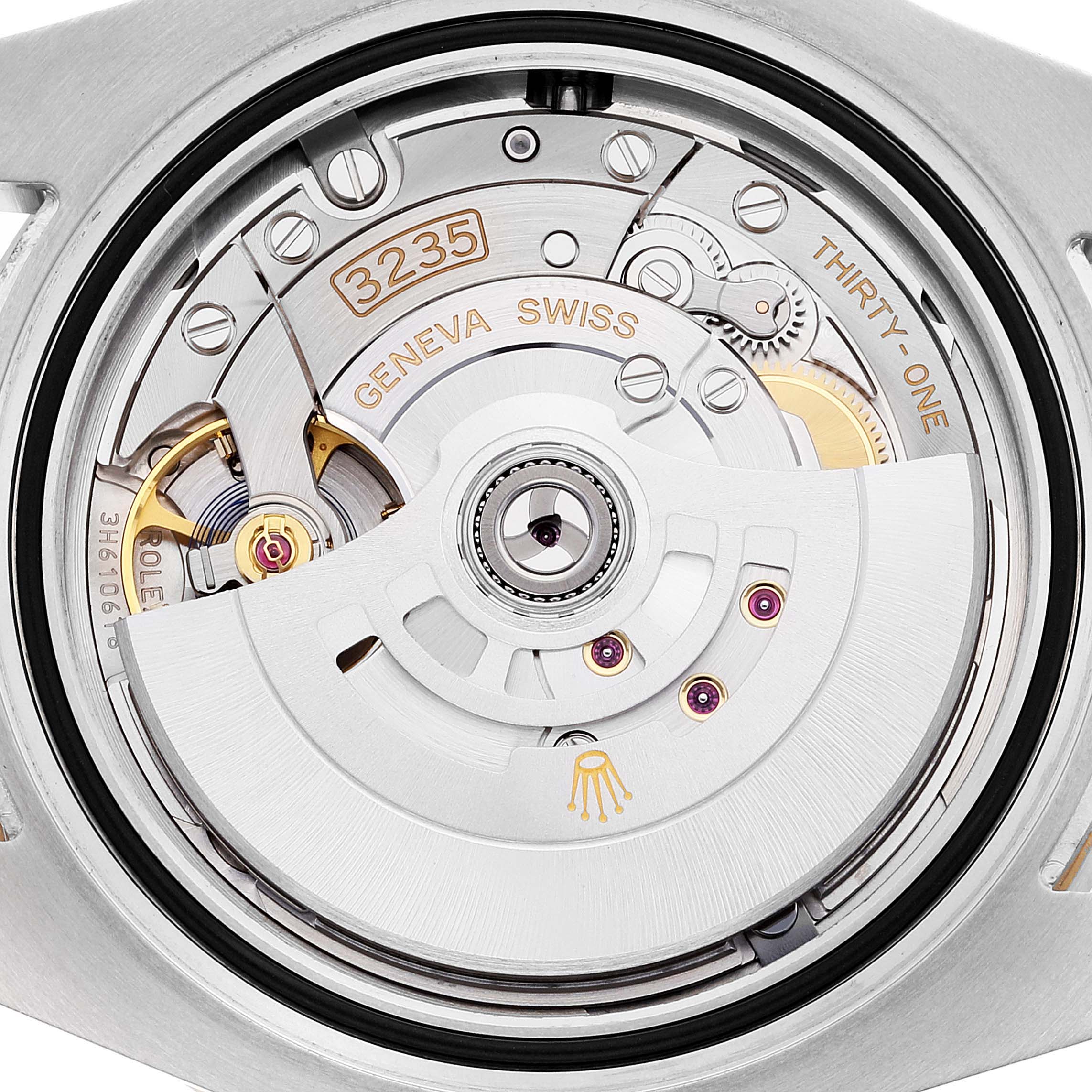 The image shows the movement and intricate inner workings of the Rolex Submariner 126613 Men's Steel and Gold (two tone) Black Dial 126613 Men's Steel and Gold (two tone) Black Dial watch from the back angle.