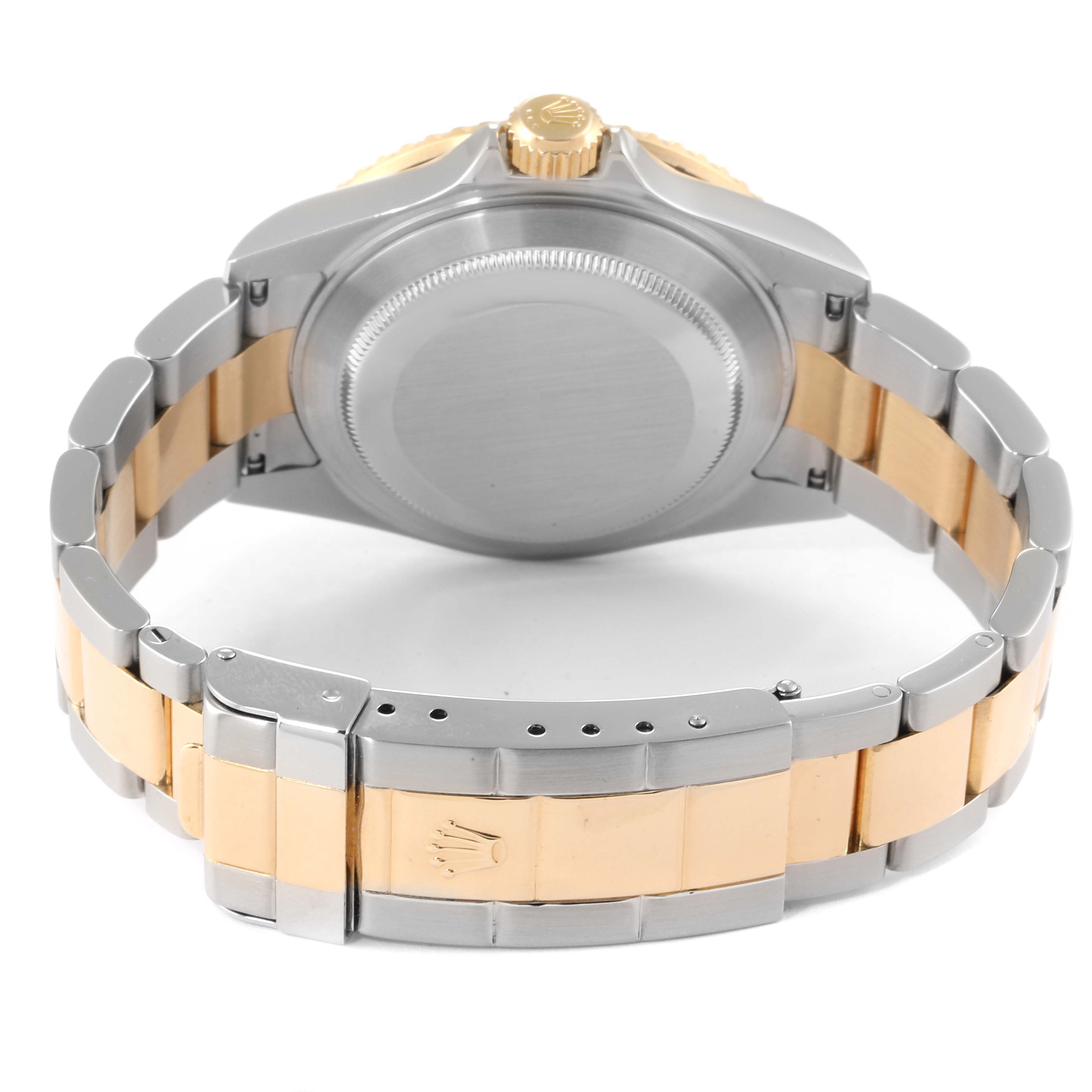 This image shows the back case and bracelet of a Rolex Submariner 16613 Men
s Steel and Gold (two tone) Blue Dial 16613 Men
s Steel and Gold (two tone) Blue Dial watch, focusing on the clasp and rear side.