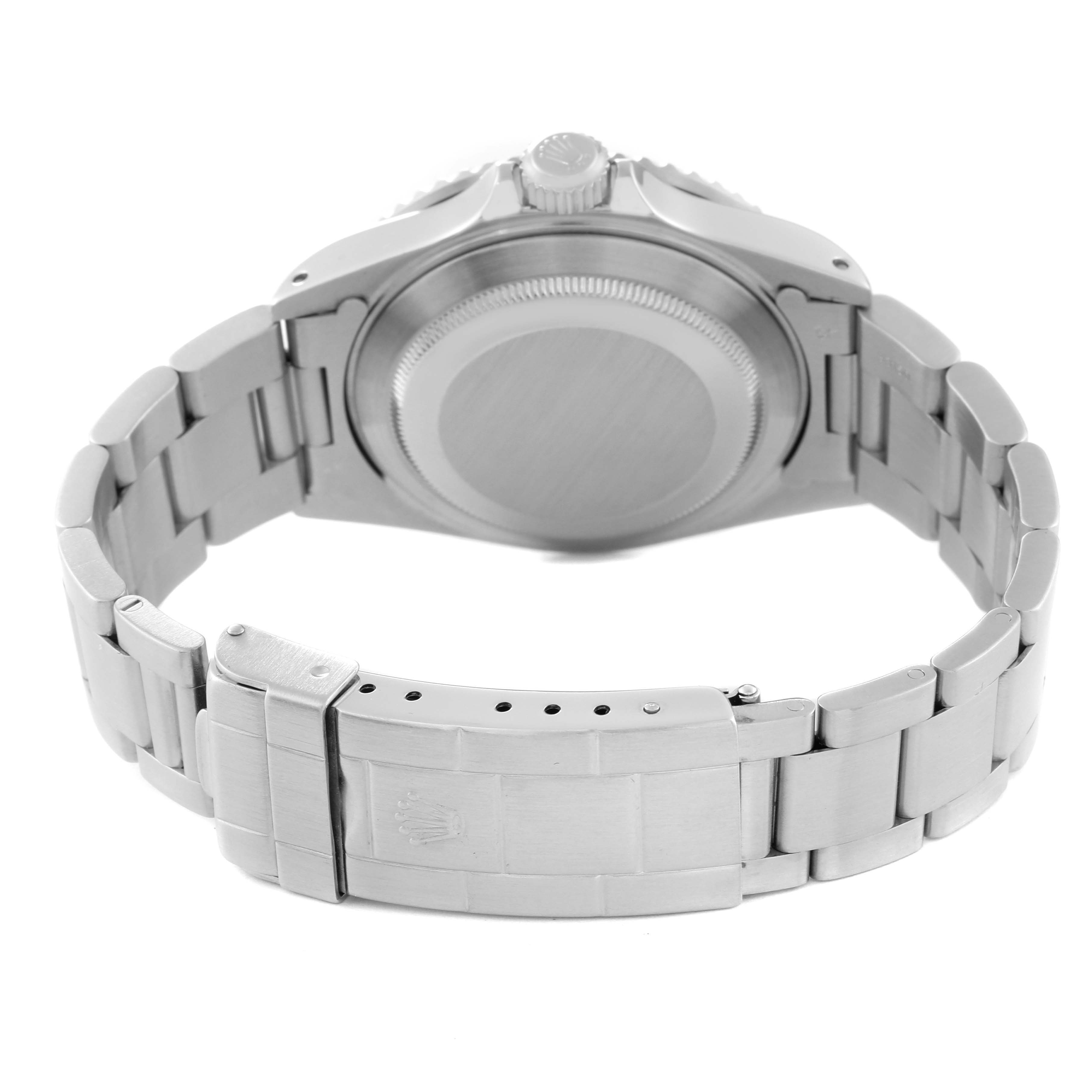 The image shows the back of a Rolex Submariner 16610 Men's Stainless Steel Black Dial 16610 Men's Stainless Steel Black Dial watch, highlighting its case back and metal bracelet with clasp.