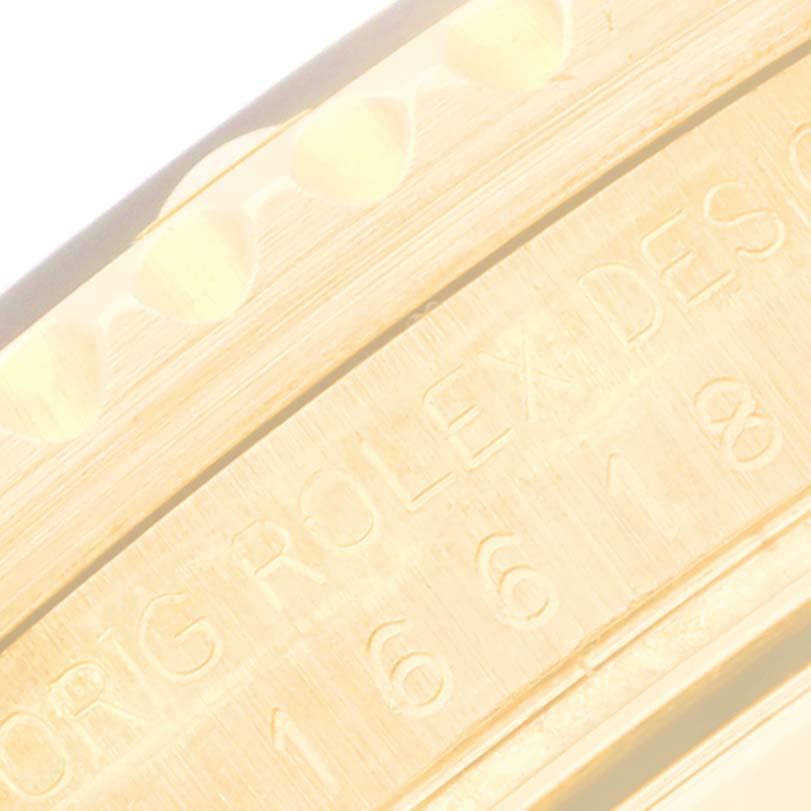 The image shows a close-up of the side of a Rolex Submariner 16618 Men's Yellow Gold Blue Dial 16618 Men's Yellow Gold Blue Dial, focusing on the engraved model number.