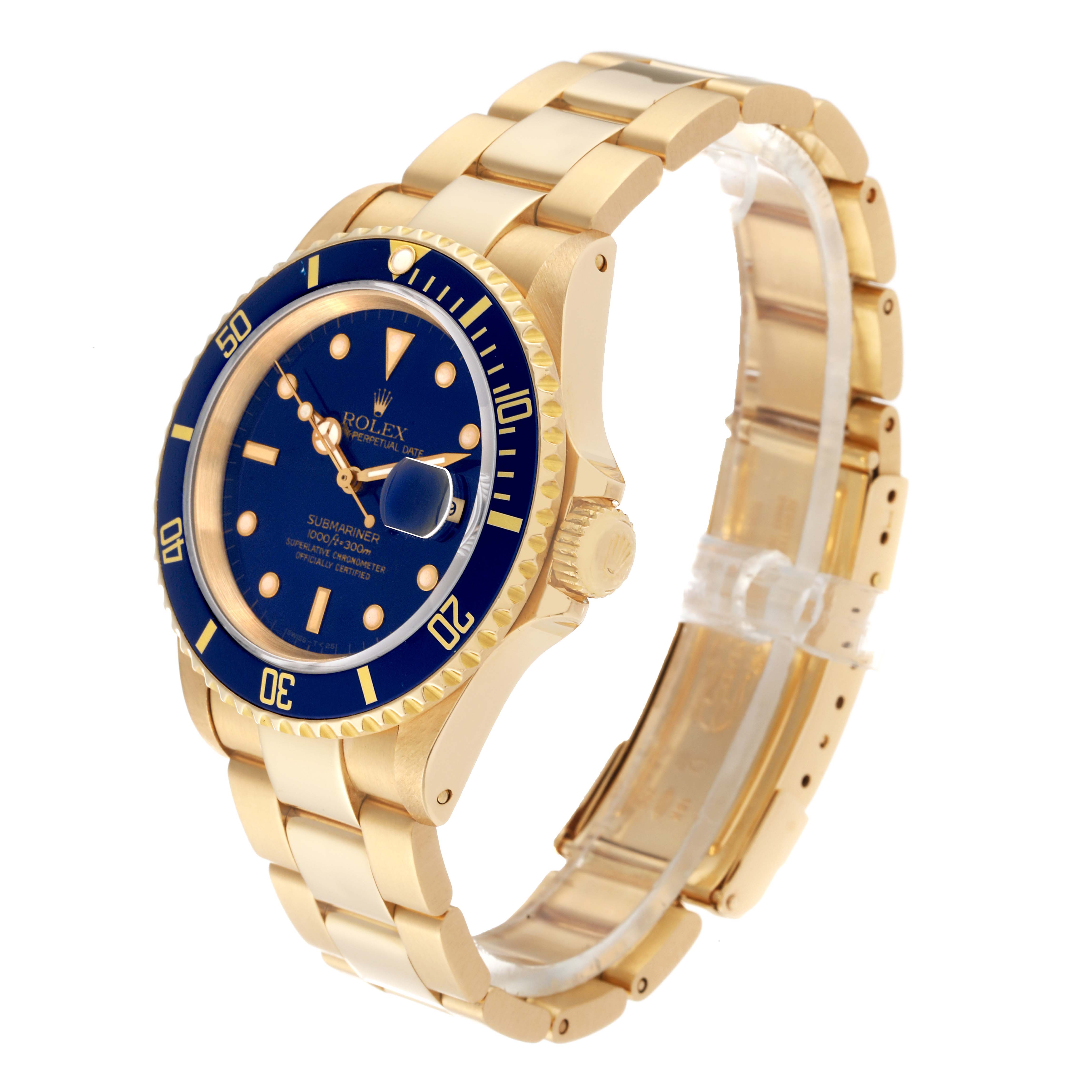 This Rolex Submariner 16618 Men's Yellow Gold Blue Dial 16618 Men's Yellow Gold Blue Dial watch is shown at an angle highlighting the blue dial, bezel, crown, and gold bracelet.
