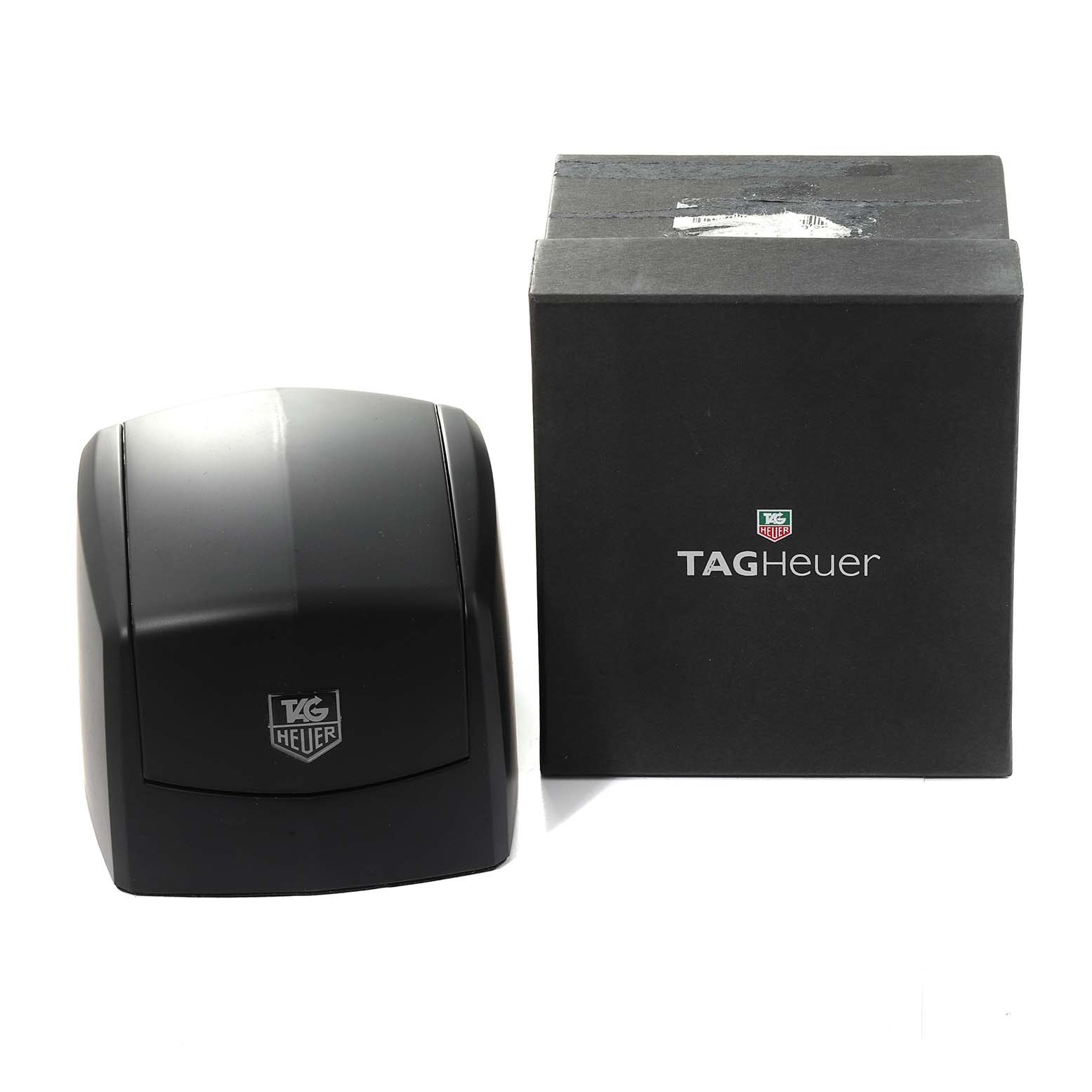 The image shows the packaging for the Tag Heuer Limited Edition WBD218A.FC6445 Men's Titanium Black Dial WBD218A.FC6445 Men's Titanium Black Dial watch, including a black box and protective case.