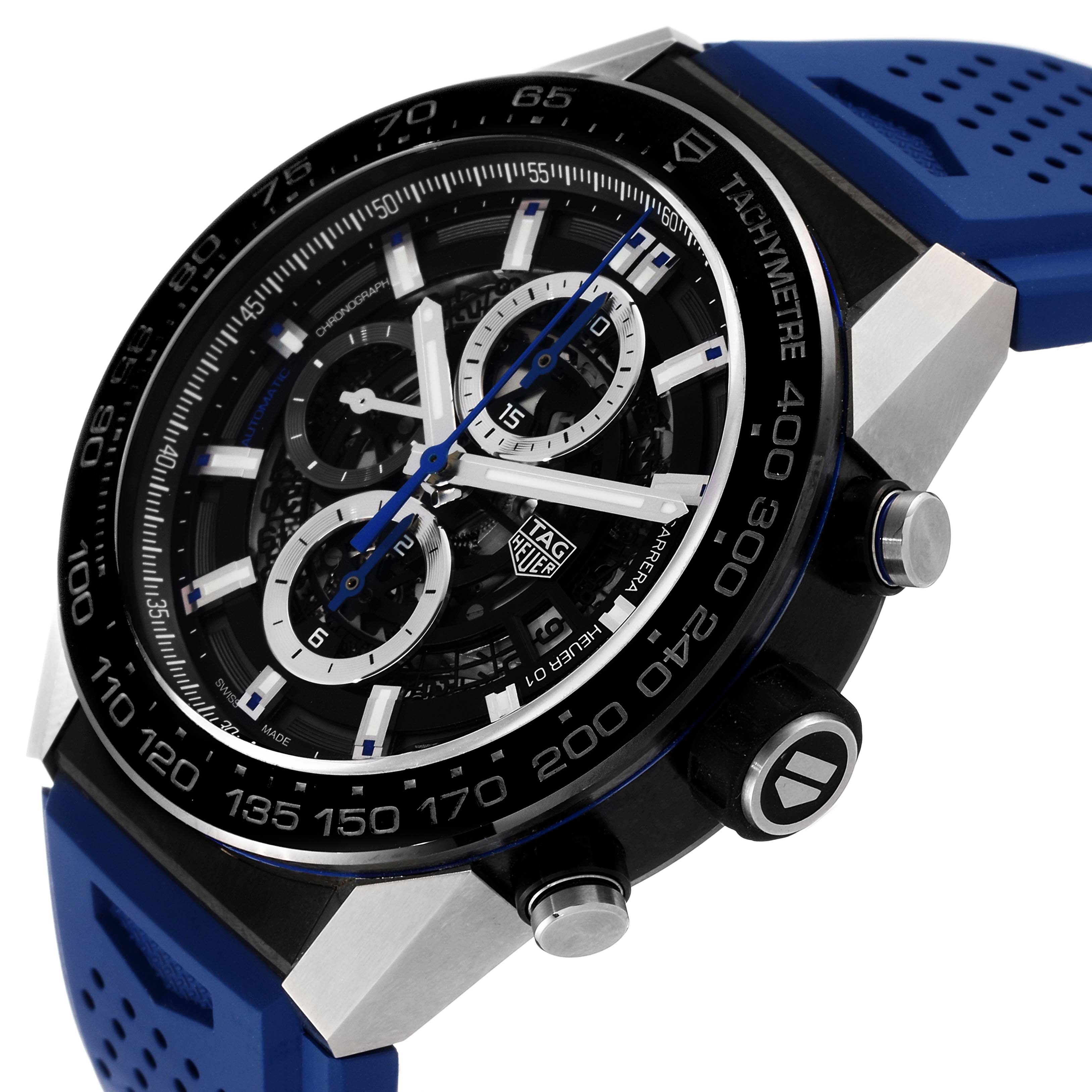 The Carrera model by Tag Heuer is shown at an oblique angle, highlighting the bezel, dial, and blue strap.