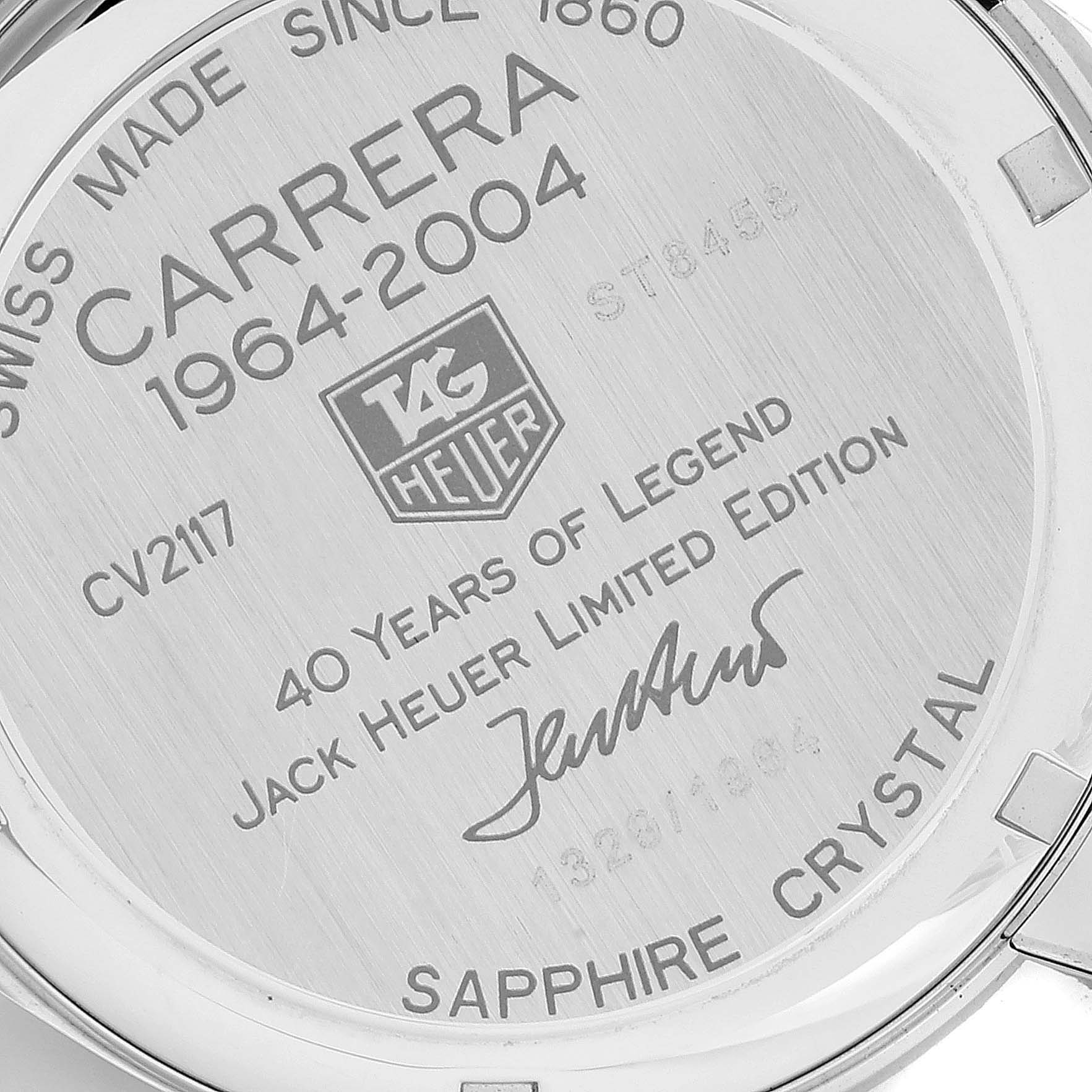 The image shows the back of the Tag Heuer Carrera Limited Edition watch with engraved details and signatures.