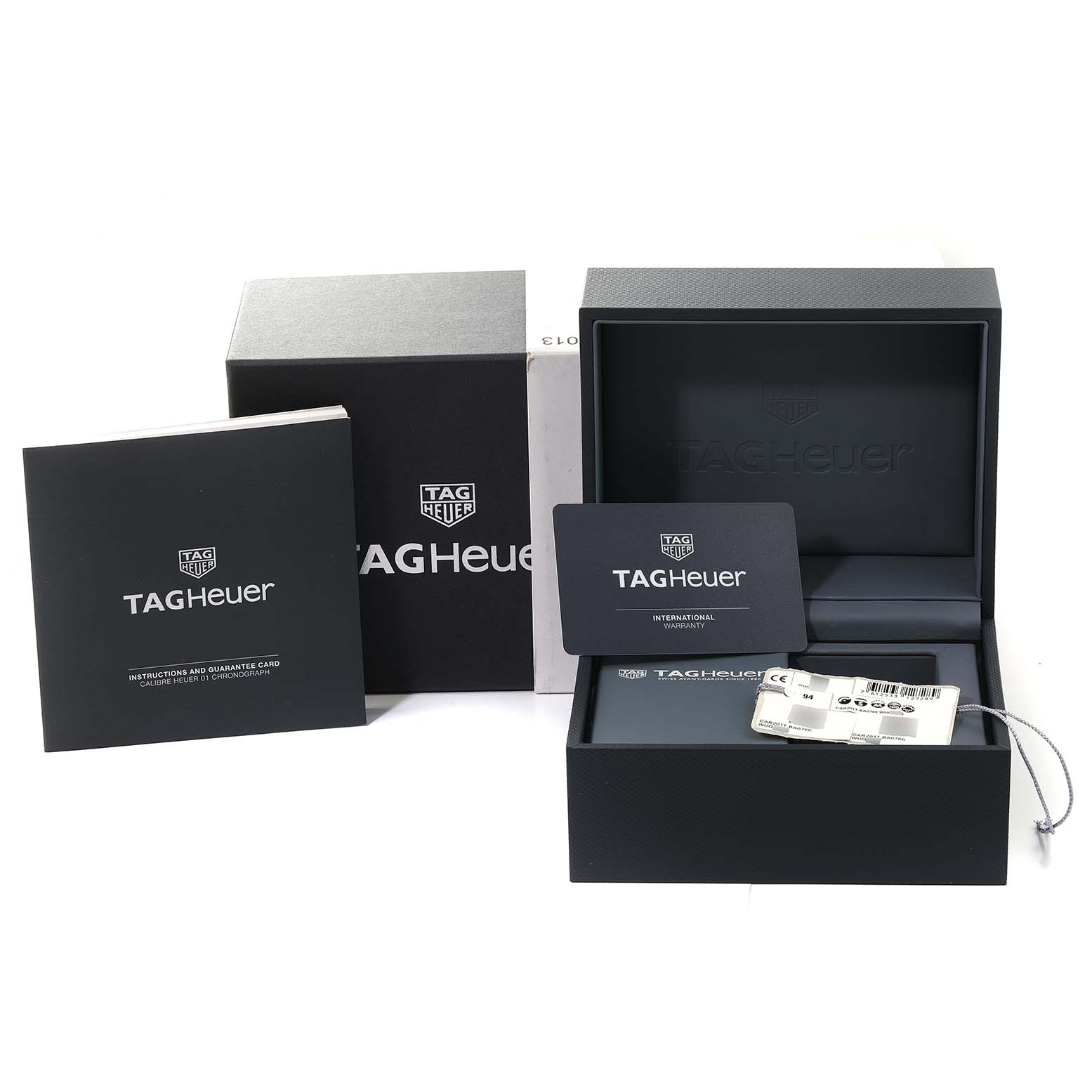 The image shows a Tag Heuer Carrera CAR201T.BA0766 Men's Stainless Steel Blue Dial CAR201T.BA0766 Men's Stainless Steel Blue Dial watch box, warranty card, instruction booklet, and additional packaging accessories.