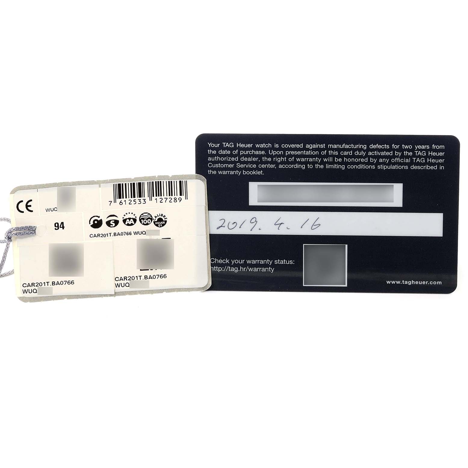 The image shows the warranty card and tag for a Tag Heuer Carrera CAR201T.BA0766 Men's Stainless Steel Blue Dial CAR201T.BA0766 Men's Stainless Steel Blue Dial model, displaying serial numbers and purchase date.