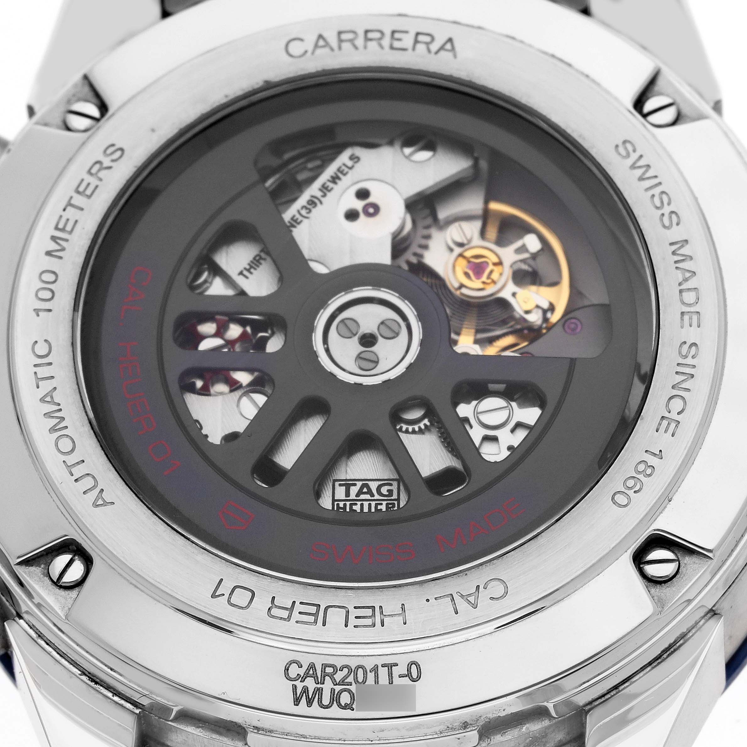 The image displays the back view of a Tag Heuer Carrera CAR201T.BA0766 Men's Stainless Steel Blue Dial CAR201T.BA0766 Men's Stainless Steel Blue Dial watch, showcasing its intricate automatic movement and "Cal. Heuer 01" inscription.