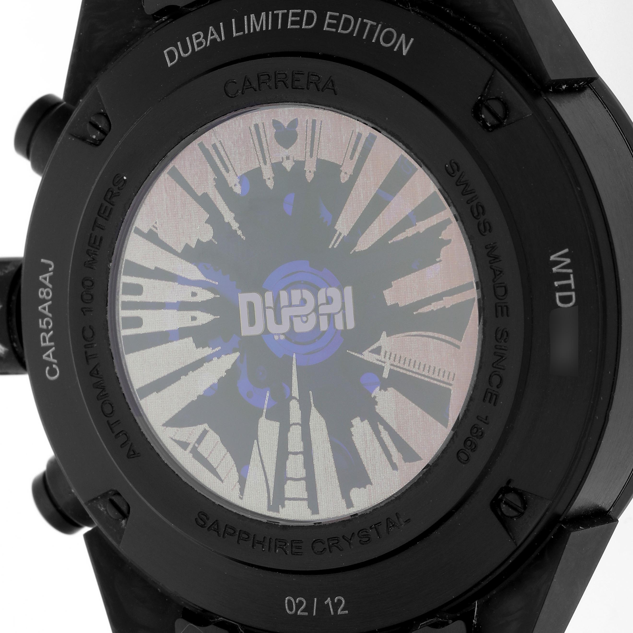 The image shows the back of a Tag Heuer Carrera CAR5A8AJ.FC6415 Men's Titanium Black Dial CAR5A8AJ.FC6415 Men's Titanium Black Dial watch, highlighting "Dubai Limited Edition" and various engravings.