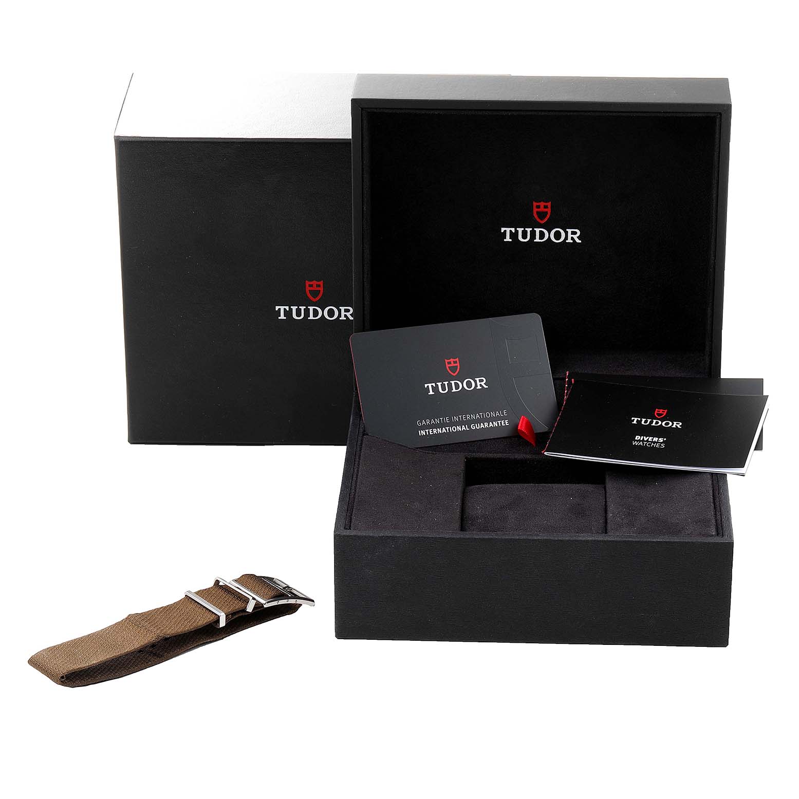 The image shows the Tudor Heritage Black Bay 79733N Men's Steel and Gold (two tone) Black Dial 79733N Men's Steel and Gold (two tone) Black Dial's packaging, including the box, warranty card, and an extra strap.