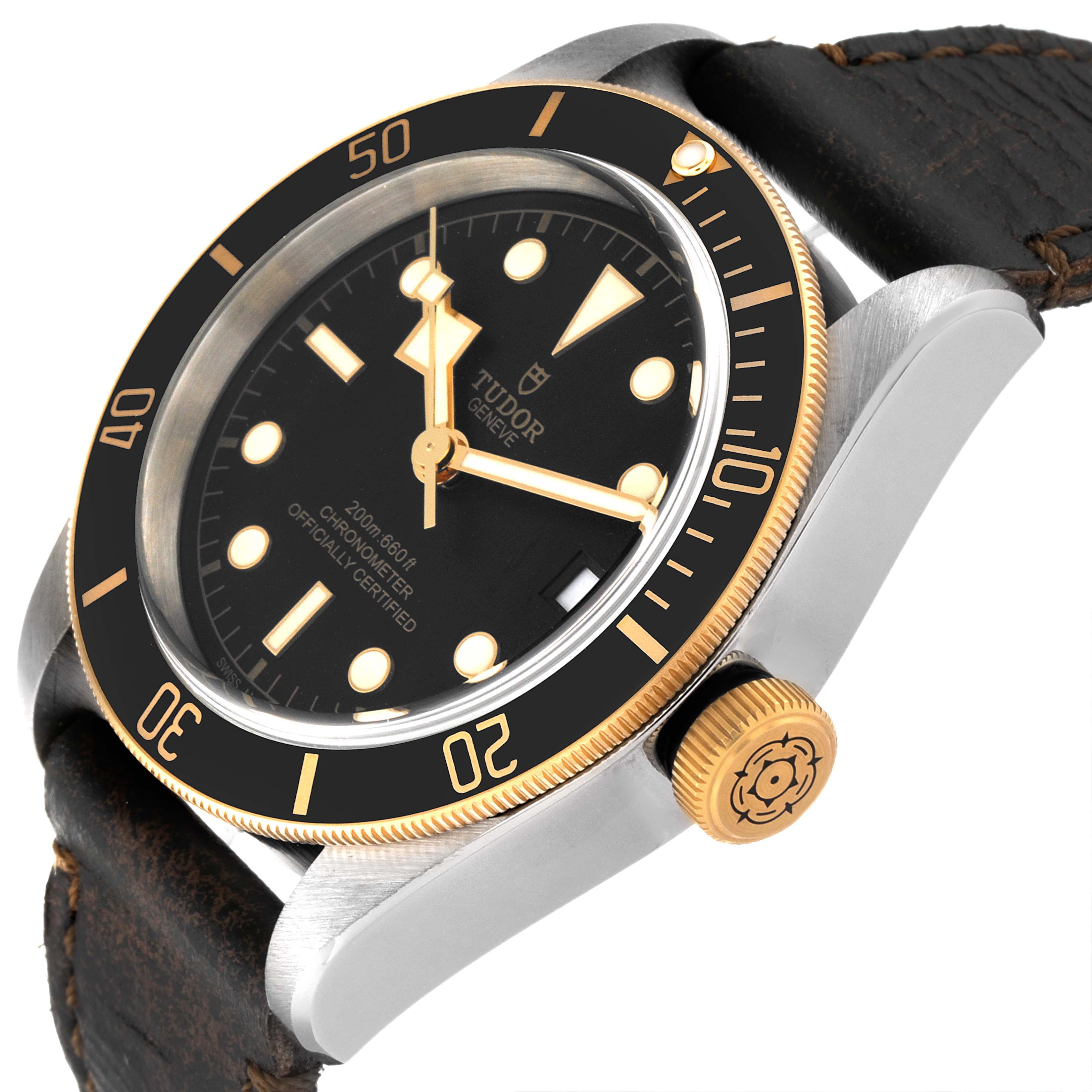 The Tudor Heritage Black Bay 79733N Men's Steel and Gold (two tone) Black Dial 79733N Men's Steel and Gold (two tone) Black Dial watch is shown at an angle highlighting the face, crown, and strap.