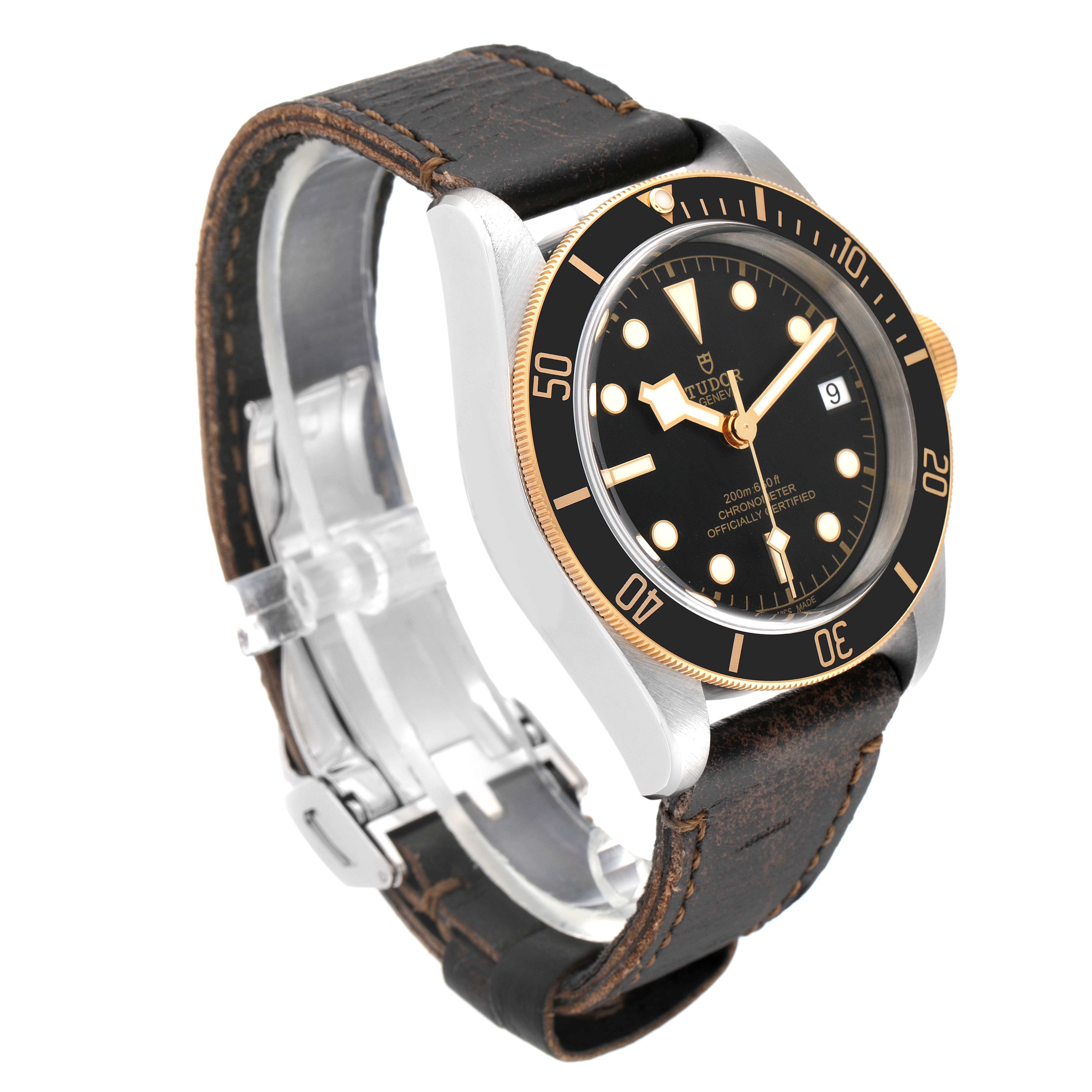 This image shows a Tudor Heritage Black Bay 79733N Men's Steel and Gold (two tone) Black Dial 79733N Men's Steel and Gold (two tone) Black Dial watch from an angled side view, highlighting the face, bezel, crown, and leather strap.