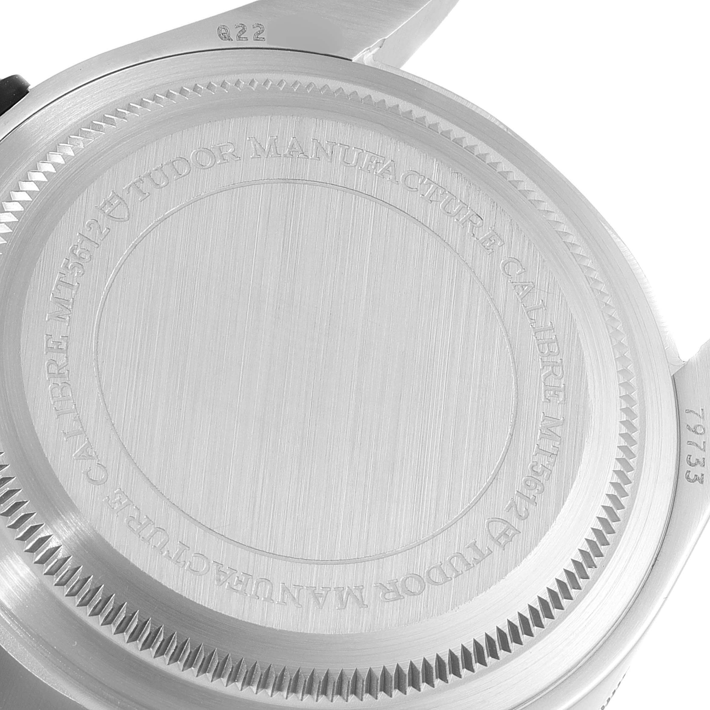 This image shows the back case of a Tudor Heritage Black Bay 79733N Men's Steel and Gold (two tone) Black Dial 79733N Men's Steel and Gold (two tone) Black Dial watch, featuring its engravings and brushed finish.