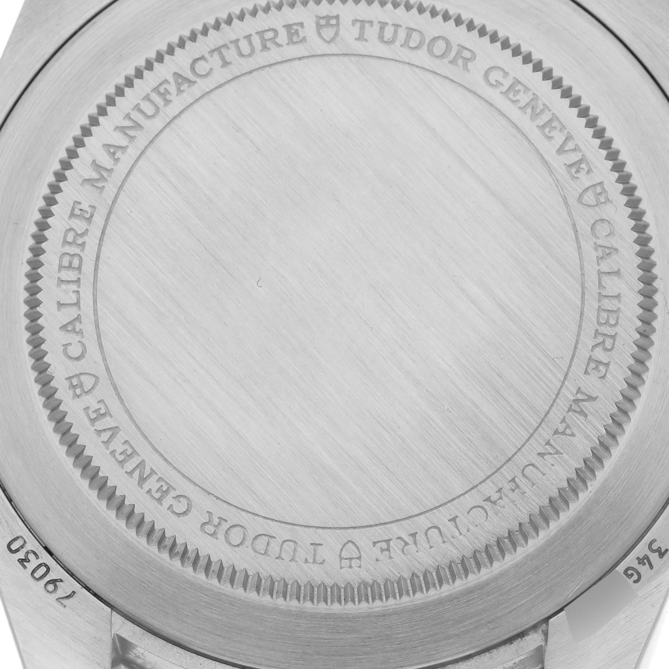 The image shows the engraved case back of a Tudor Heritage Black Bay 79030N Men's Stainless Steel Black Dial 79030N Men's Stainless Steel Black Dial watch.