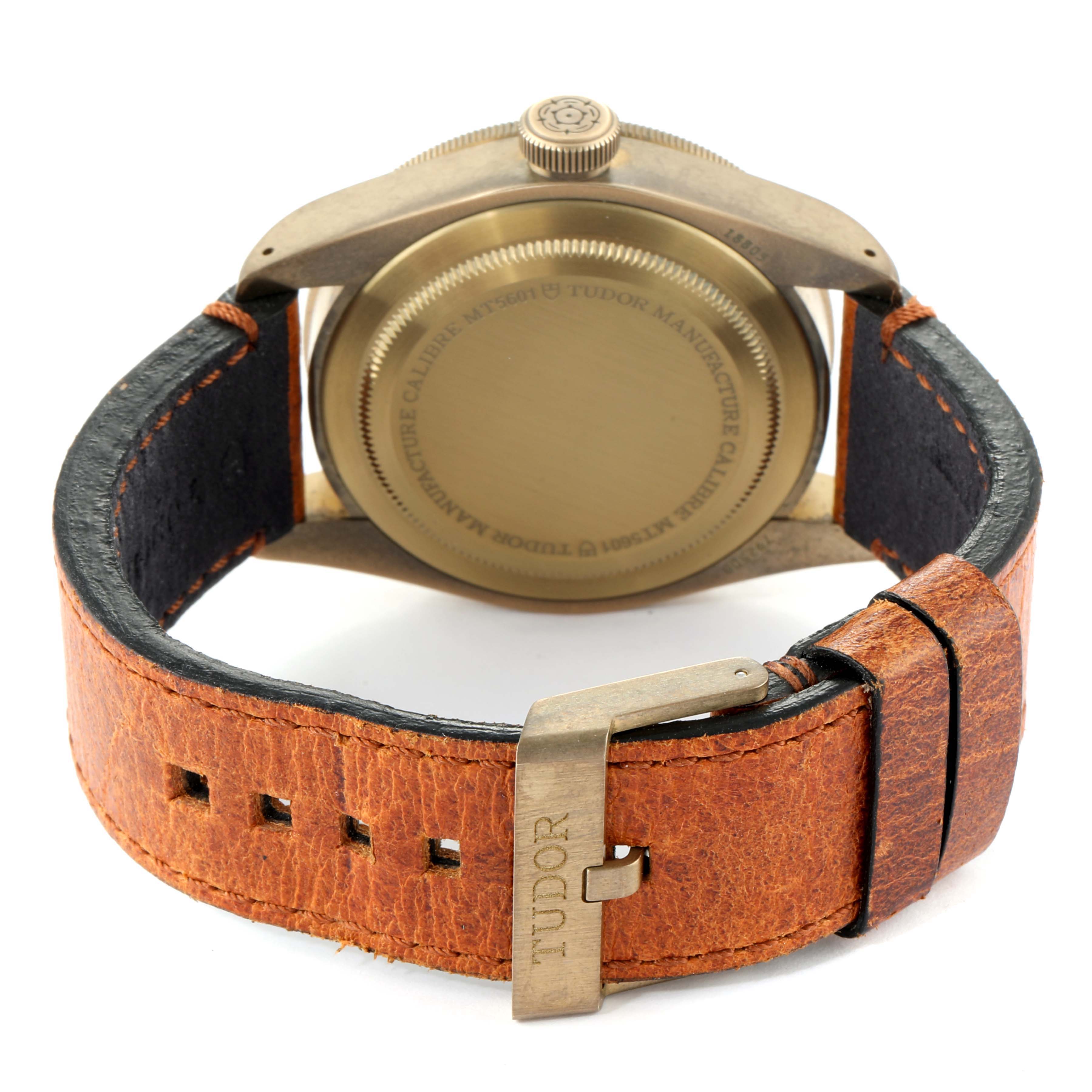 This image shows the back case and leather strap with the buckle of the Tudor Heritage Black Bay 79250B Men
s Bronze Brown Dial 79250B Men
s Bronze Brown Dial watch at a rear angle.