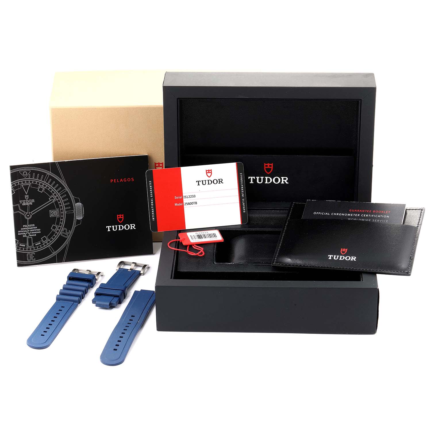 The image shows the Tudor Pelagos 25600TB Men's Titanium Blue Dial 25600TB Men's Titanium Blue Dial watch box, user manual, guarantee card, and extra blue straps from a top-front angle.