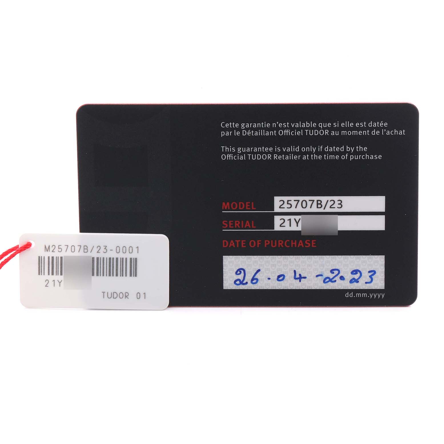 The image shows a Tudor Pelagos 25707B Men's Titanium Blue Dial 25707B Men's Titanium Blue Dial model guarantee card with model and serial details visible.