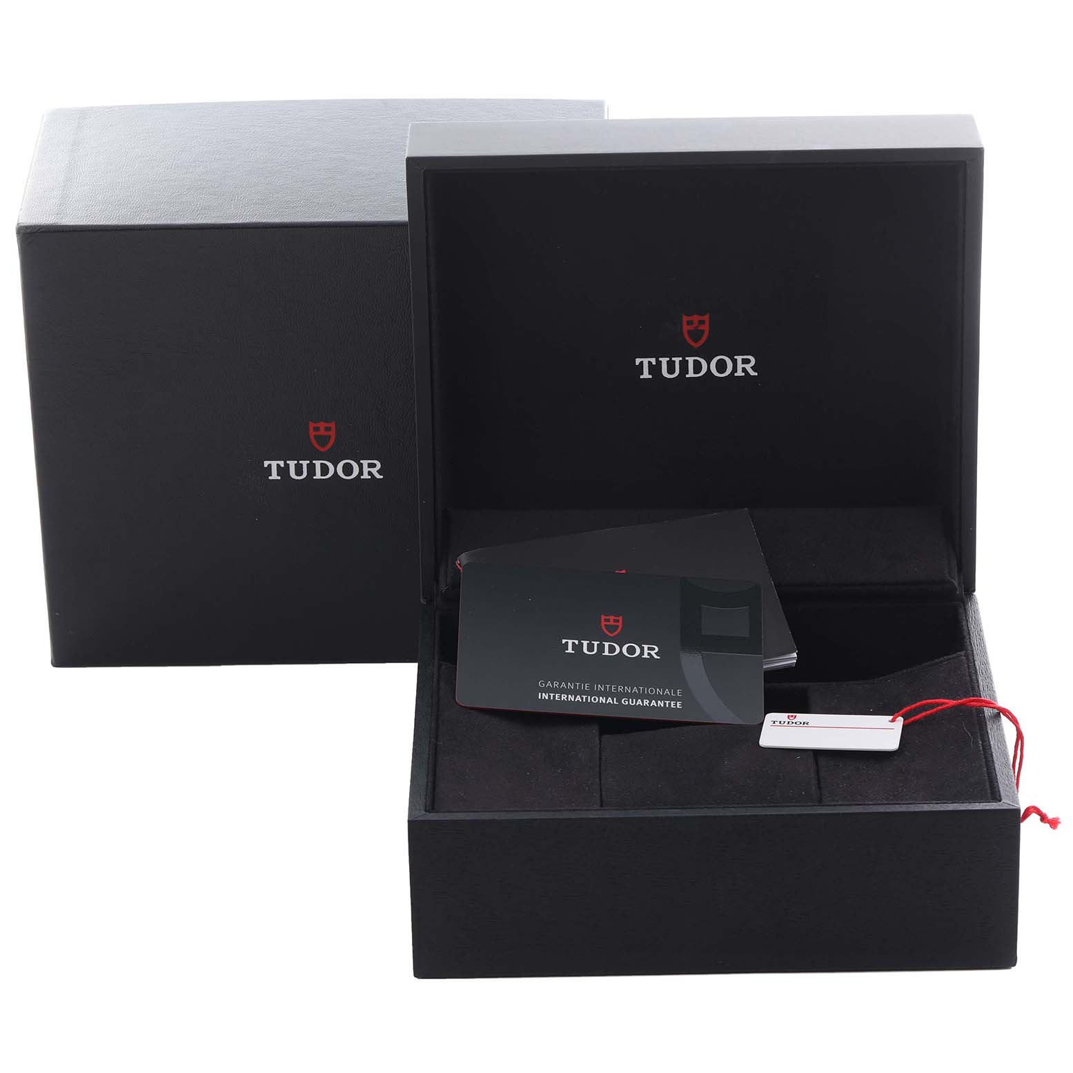 The image shows the Tudor Pelagos 25707B Men's Titanium Blue Dial 25707B Men's Titanium Blue Dial watch box, guarantee card, and a tag, viewed from the front.