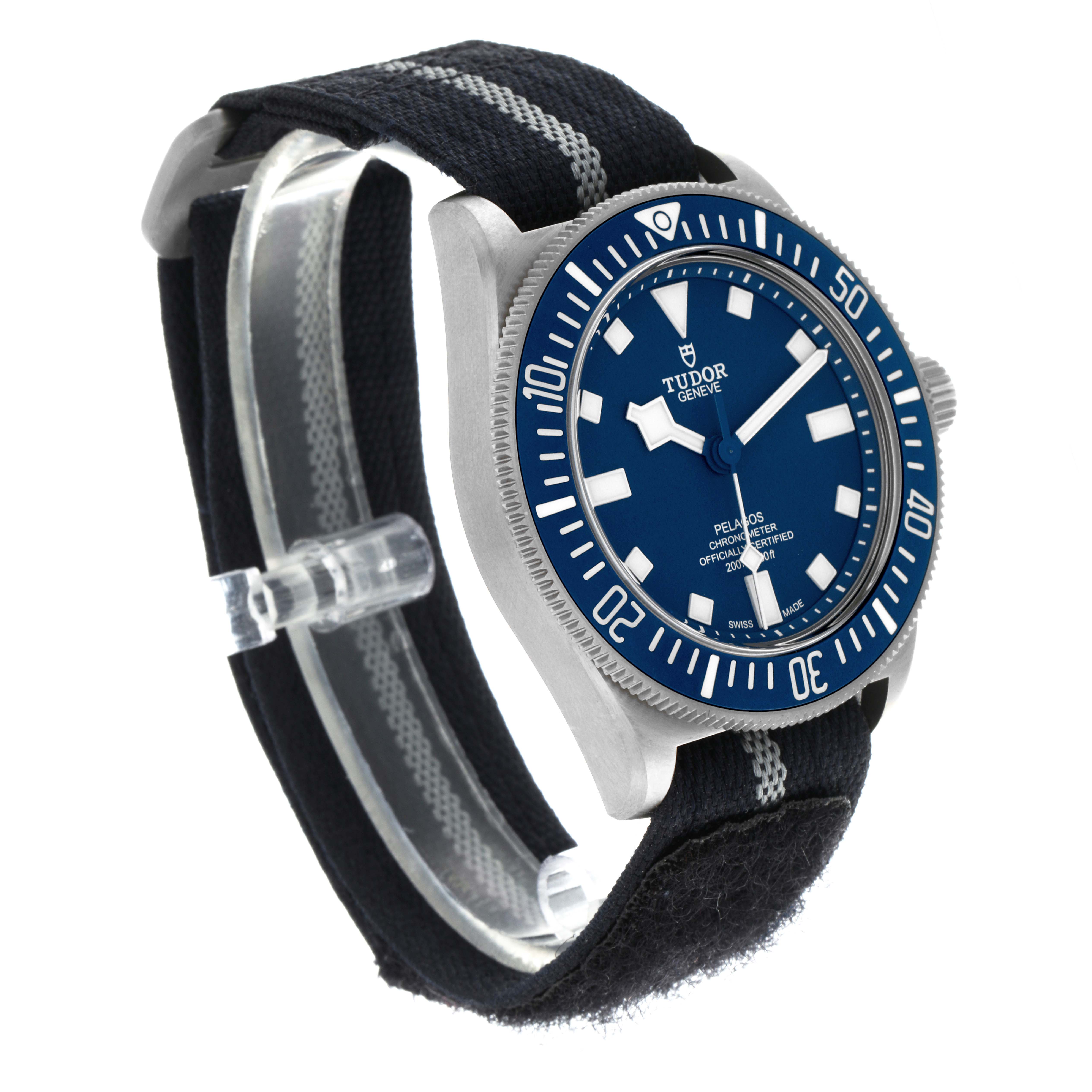 The Tudor Pelagos 25707B Men's Titanium Blue Dial 25707B Men's Titanium Blue Dial watch is shown at a three-quarter angle, highlighting the blue dial, bezel, and fabric strap.