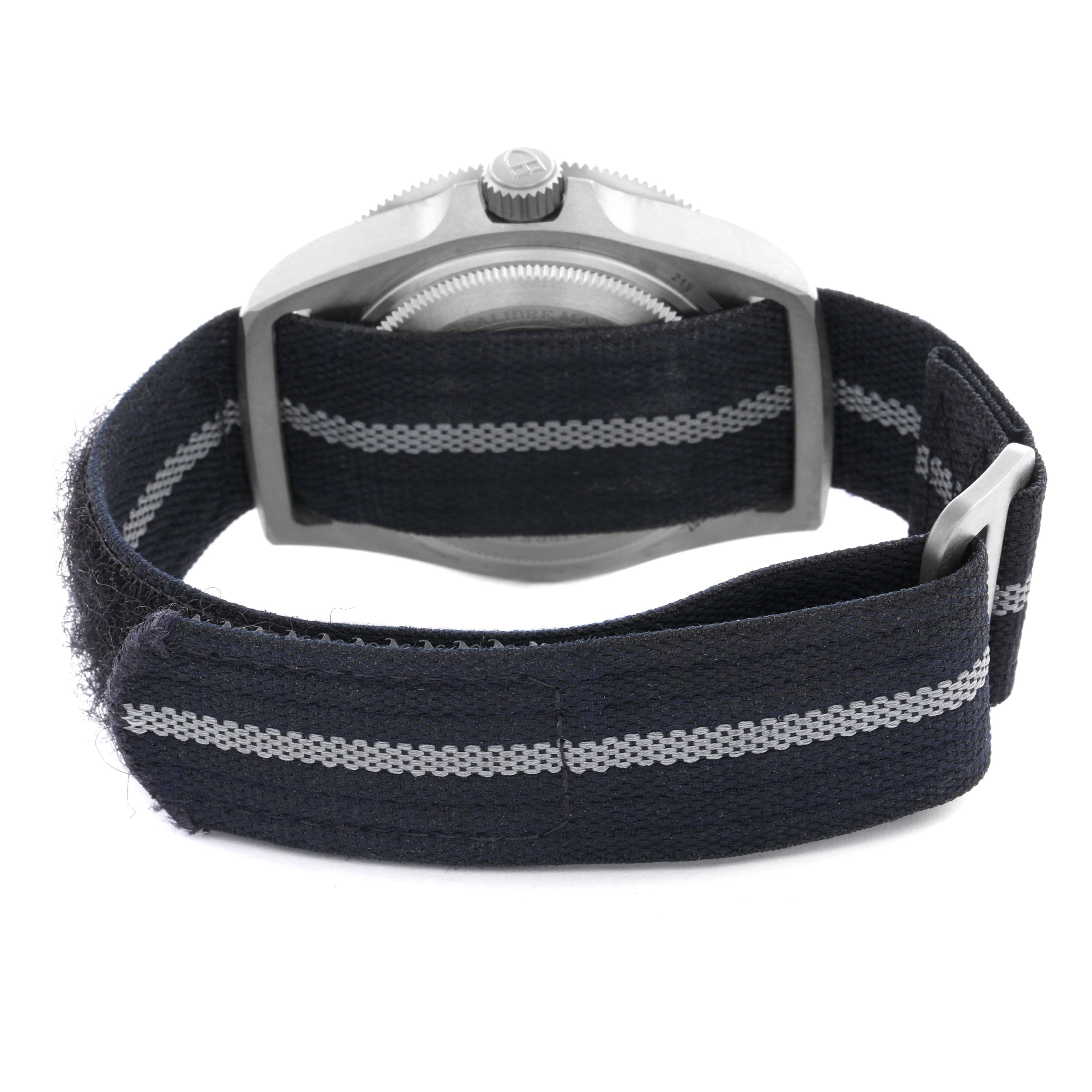 The Tudor Pelagos 25707B Men's Titanium Blue Dial 25707B Men's Titanium Blue Dial watch is shown from the back, highlighting the case, crown, and fabric strap.