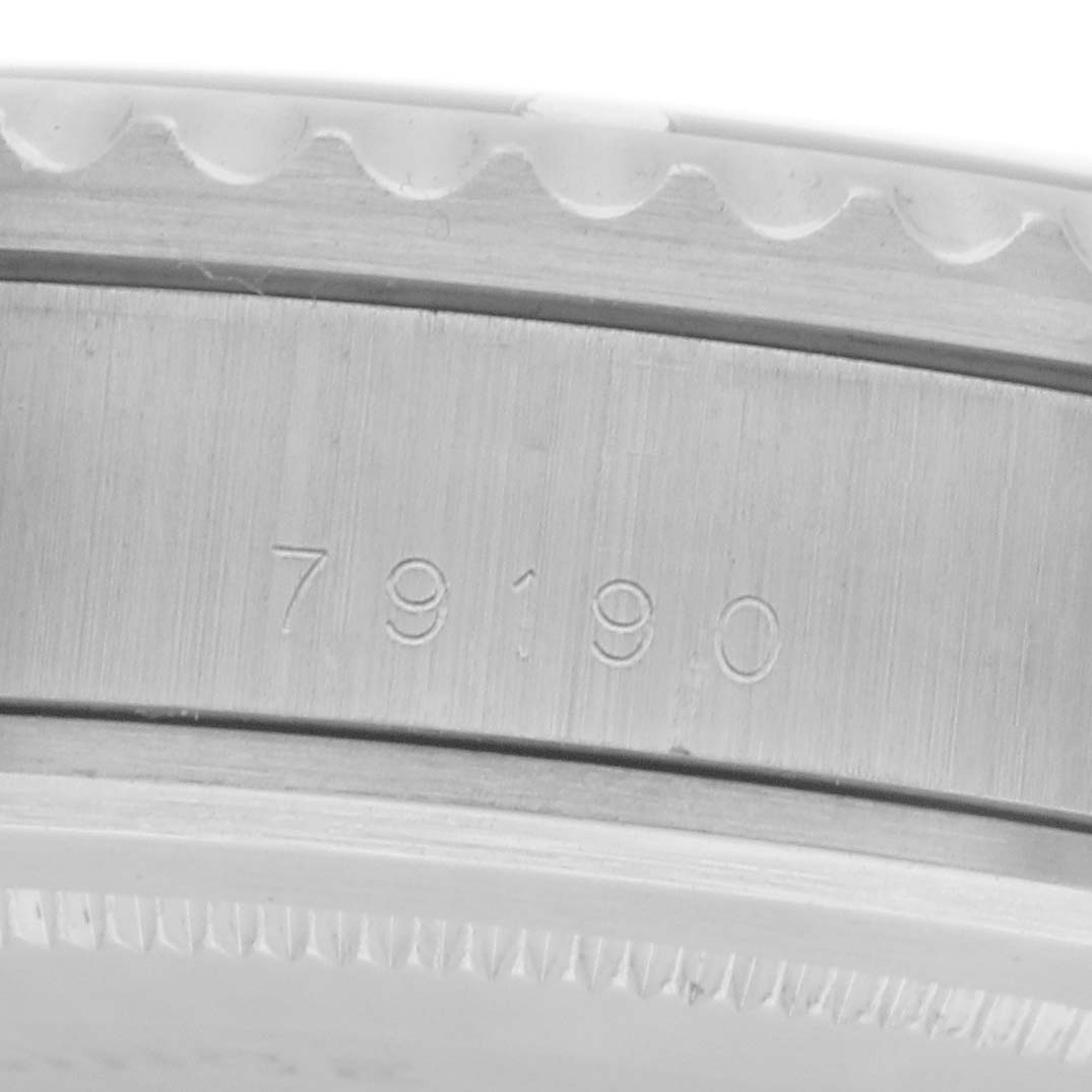 The image shows a close-up of the side of a Tudor Submariner 79190 Men's Stainless Steel Black Dial 79190 Men's Stainless Steel Black Dial watch featuring the model number engraved on the case.