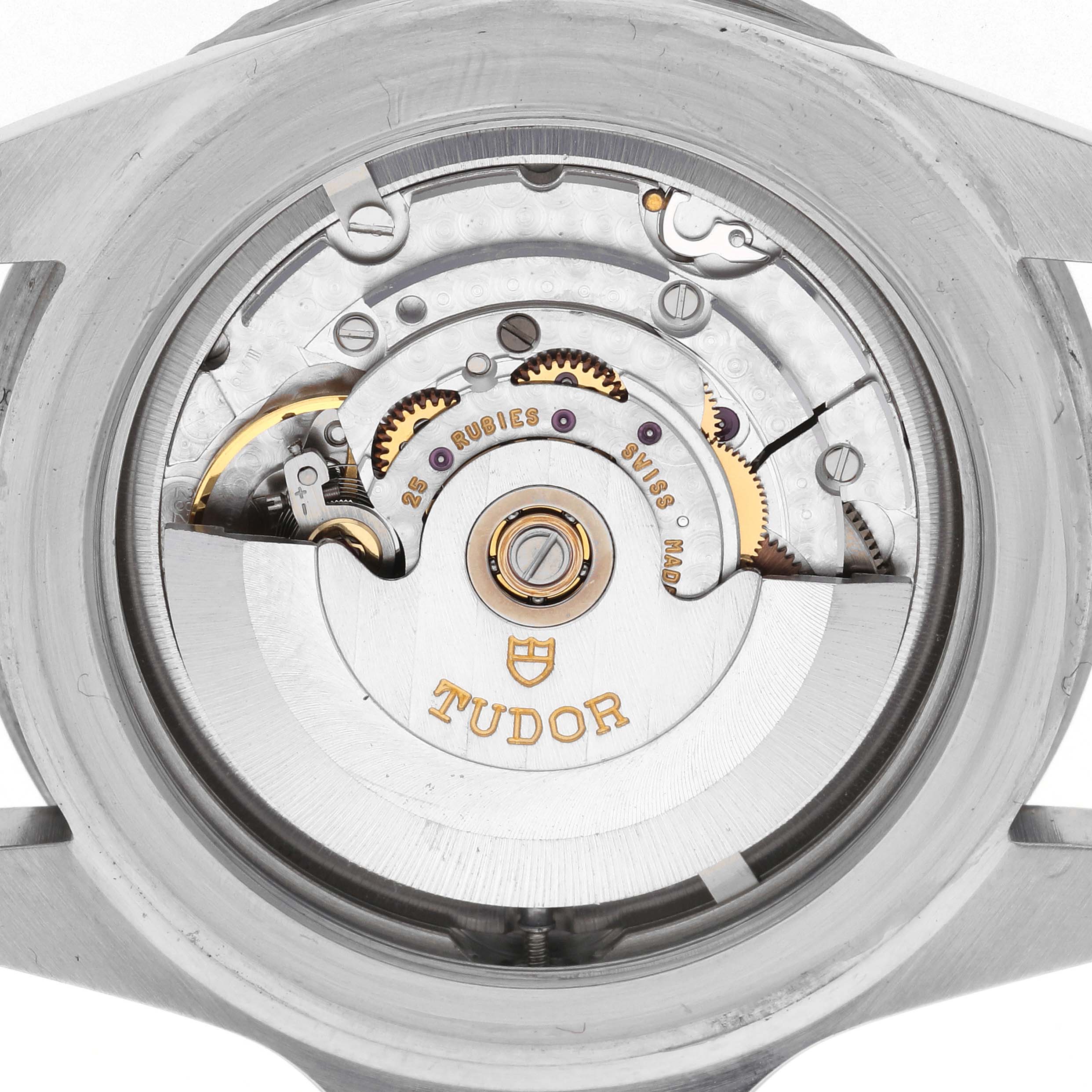 The image shows the movement and inner workings of a Tudor Submariner 79190 Men's Stainless Steel Black Dial 79190 Men's Stainless Steel Black Dial watch from a back view, highlighting gears and the rotor.