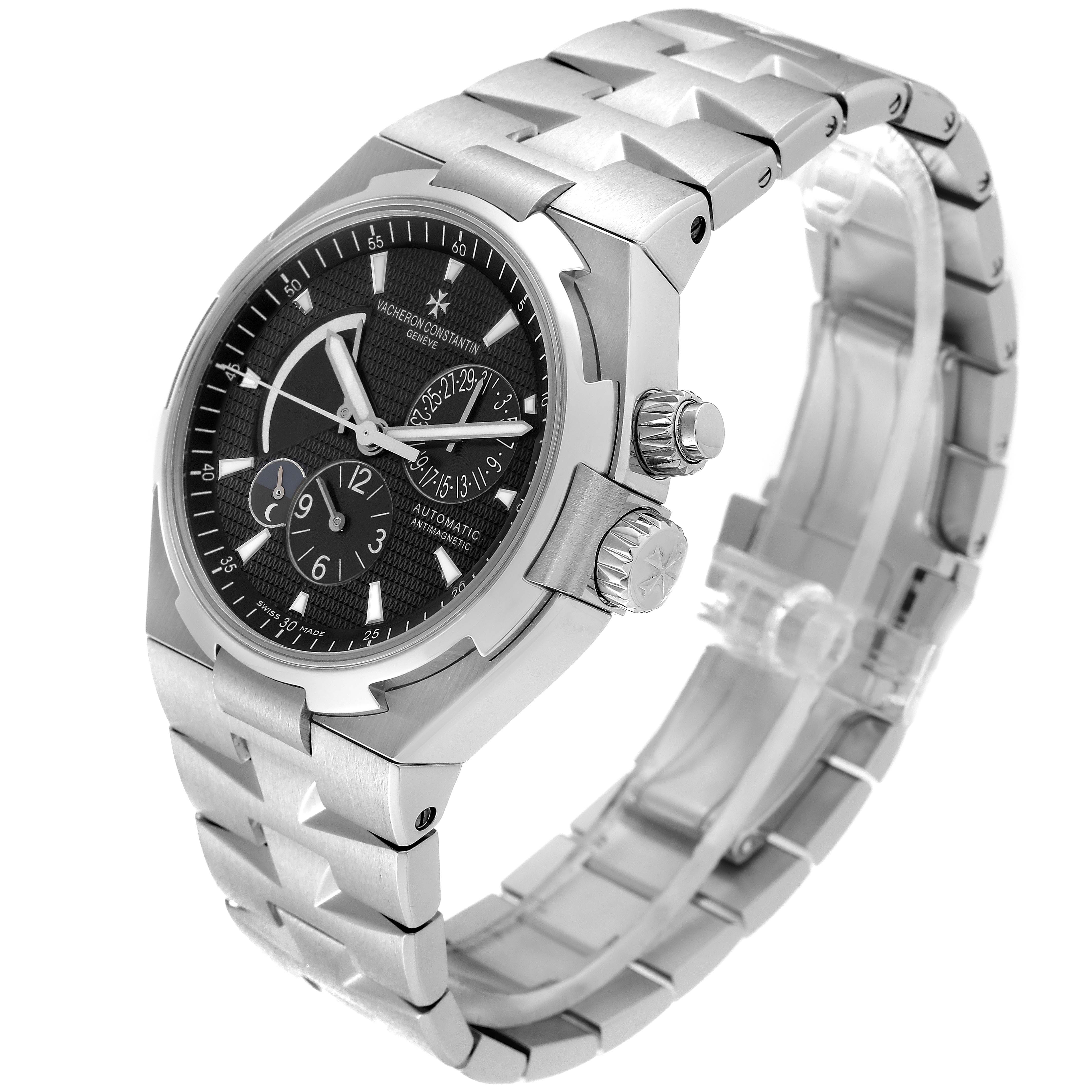This image shows a Vacheron Constantin Overseas 47450/B01A-9227 Men's Stainless Steel Black Dial 47450/B01A-9227 Men's Stainless Steel Black Dial watch angled to display the face, crown, and bracelet.