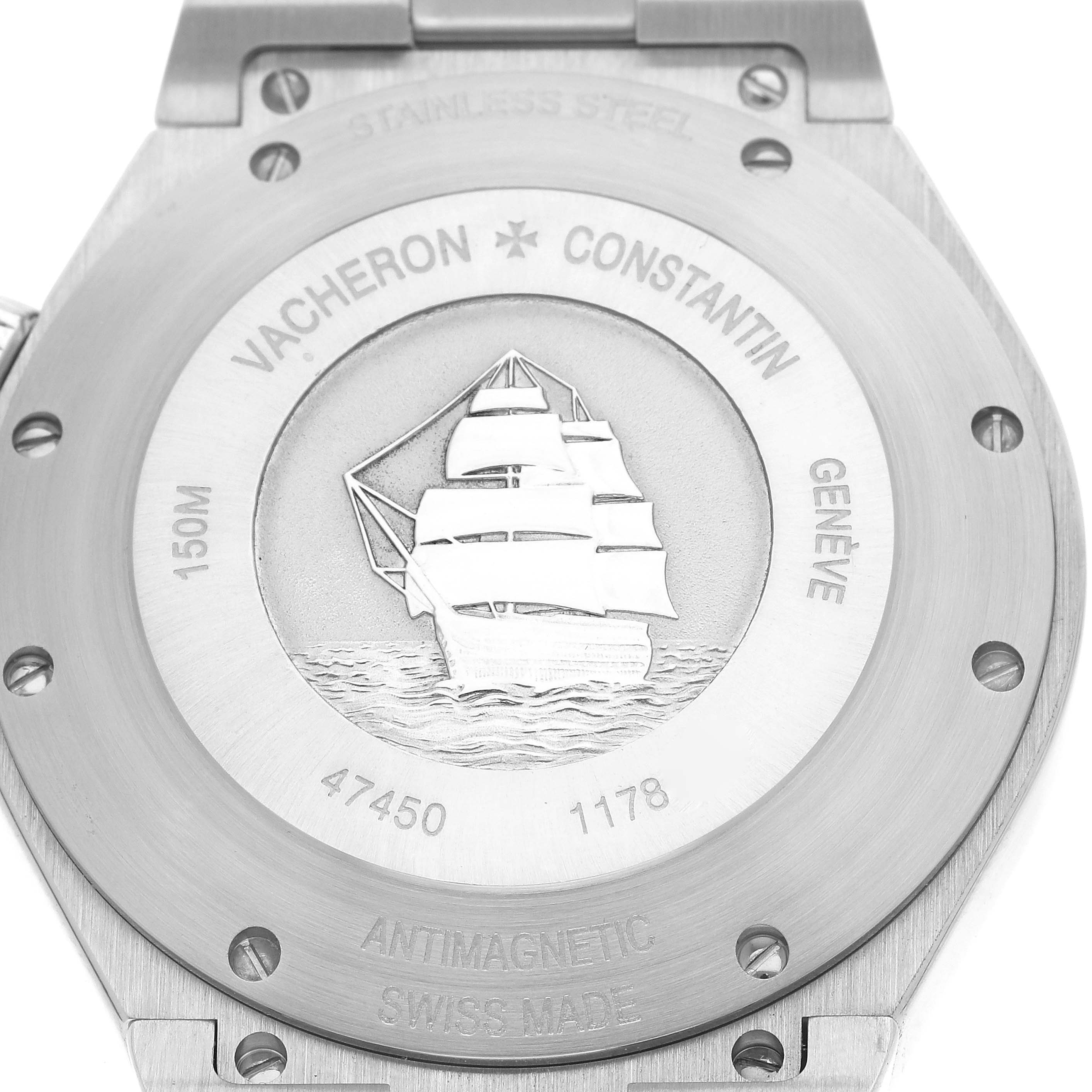 The image shows the stainless steel case back of the Vacheron Constantin Overseas 47450/B01A-9227 Men's Stainless Steel Black Dial 47450/B01A-9227 Men's Stainless Steel Black Dial model watch, featuring an engraved sailing ship.