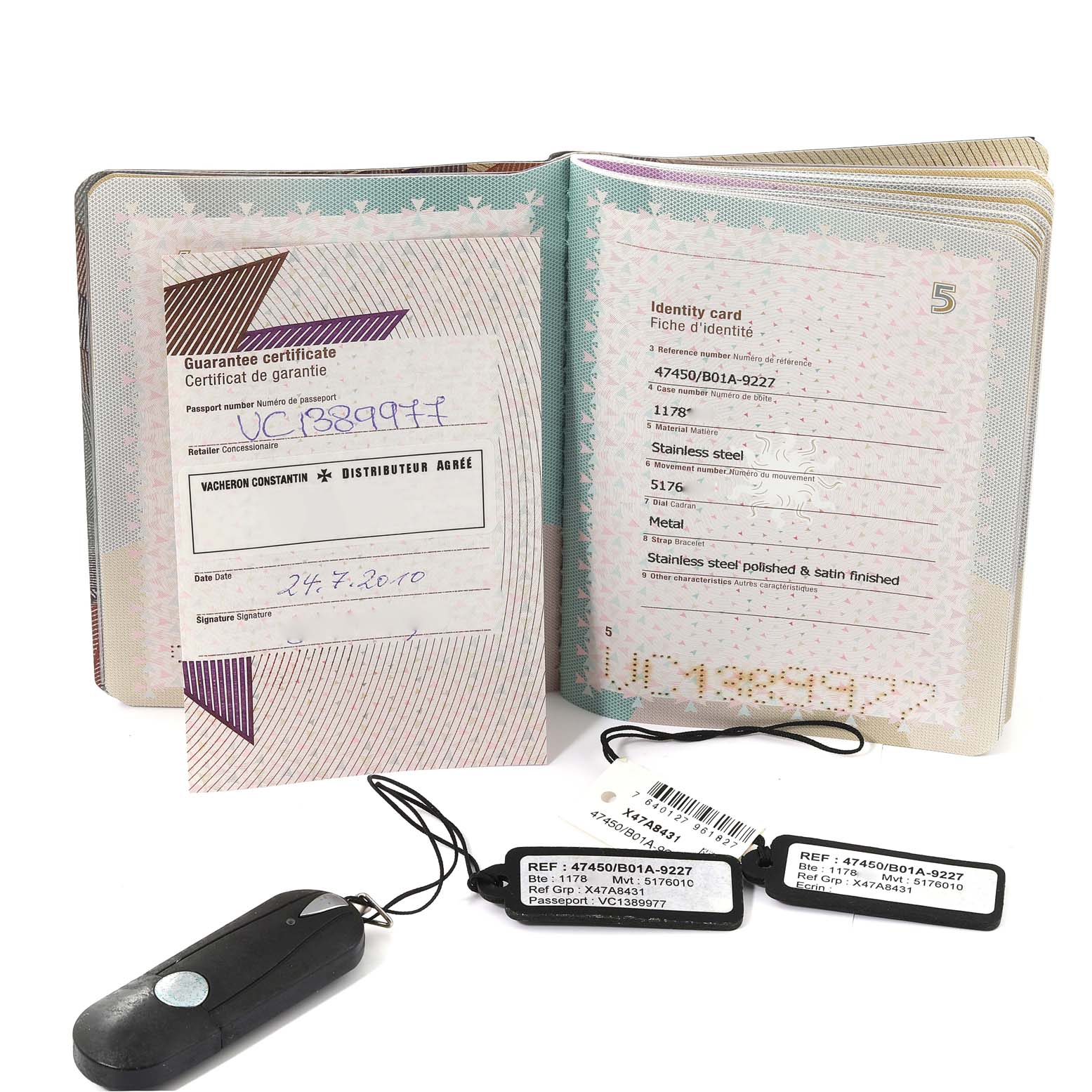 The image shows the guarantee certificate, identity card, tags, and a remote for the Vacheron Constantin Overseas 47450/B01A-9227 Men's Stainless Steel Black Dial 47450/B01A-9227 Men's Stainless Steel Black Dial watch model.