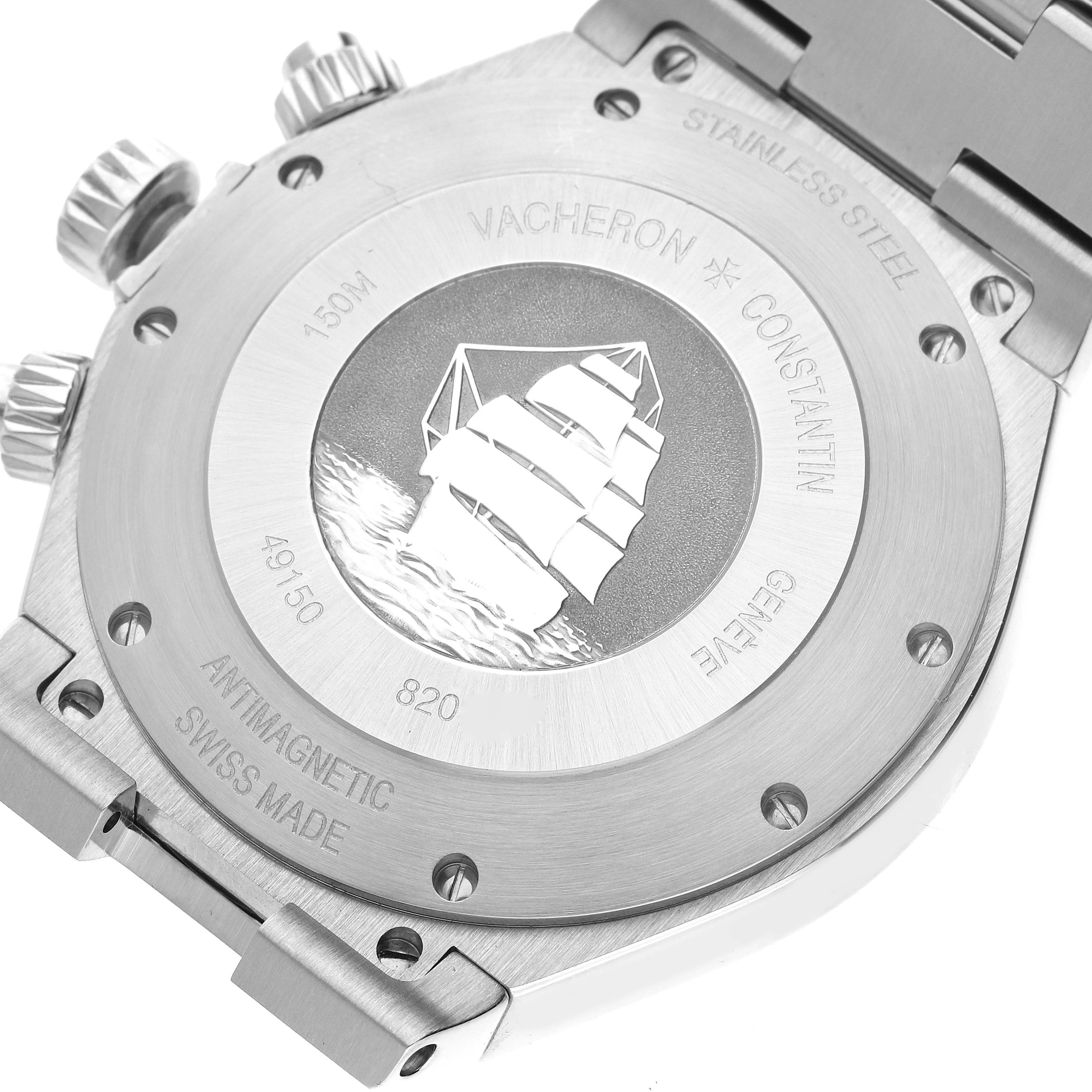 This image shows the case back of the Vacheron Constantin Overseas 49150/B01A-9095 Men's Stainless Steel Silver Dial 49150/B01A-9095 Men's Stainless Steel Silver Dial watch, featuring engraved text and a ship motif.