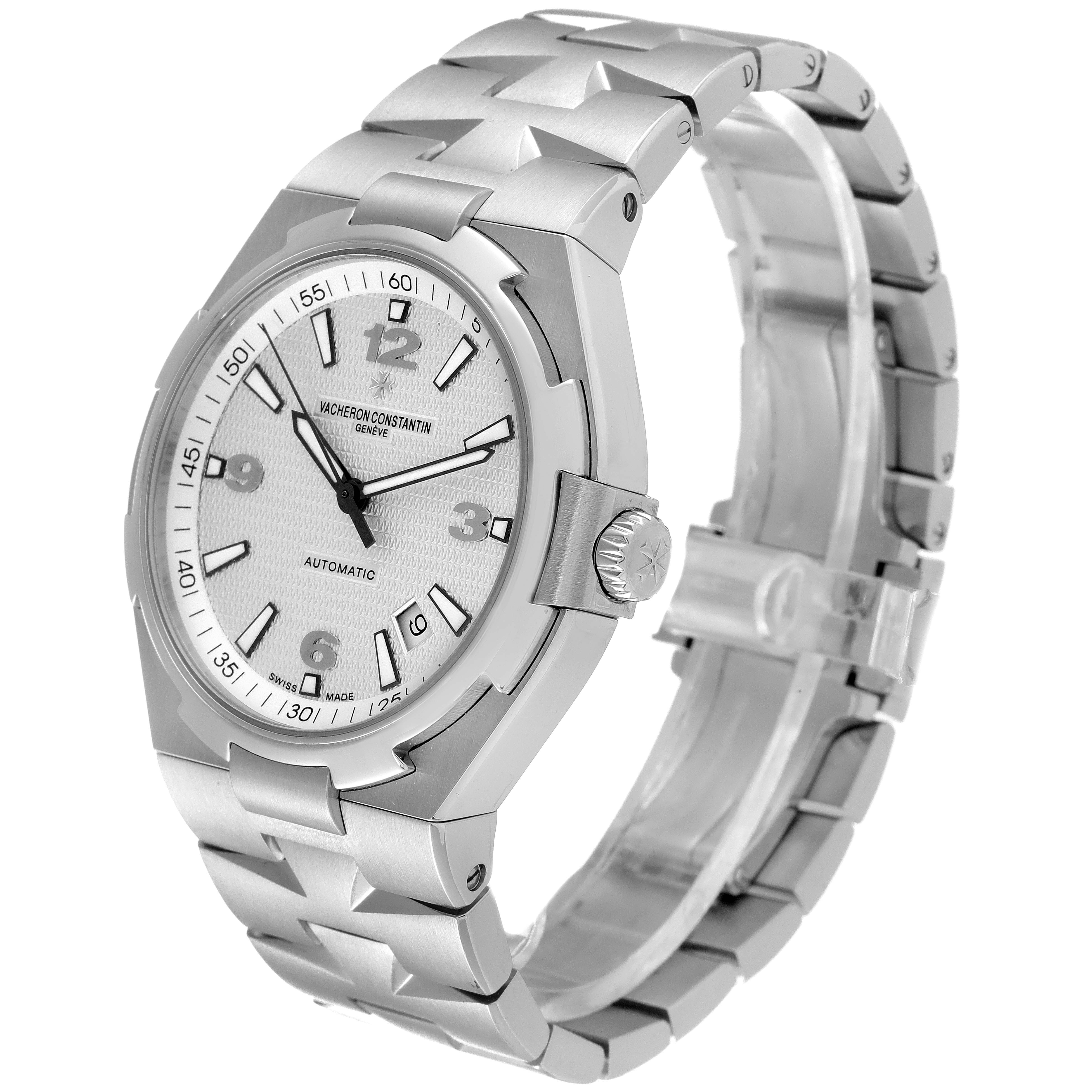 The image shows a Vacheron Constantin Overseas 47040B01A-9093 Men's Stainless Steel Silver Dial 47040B01A-9093 Men's Stainless Steel Silver Dial watch at a side angle highlighting the silver dial, bezel, crown, and metal bracelet.
