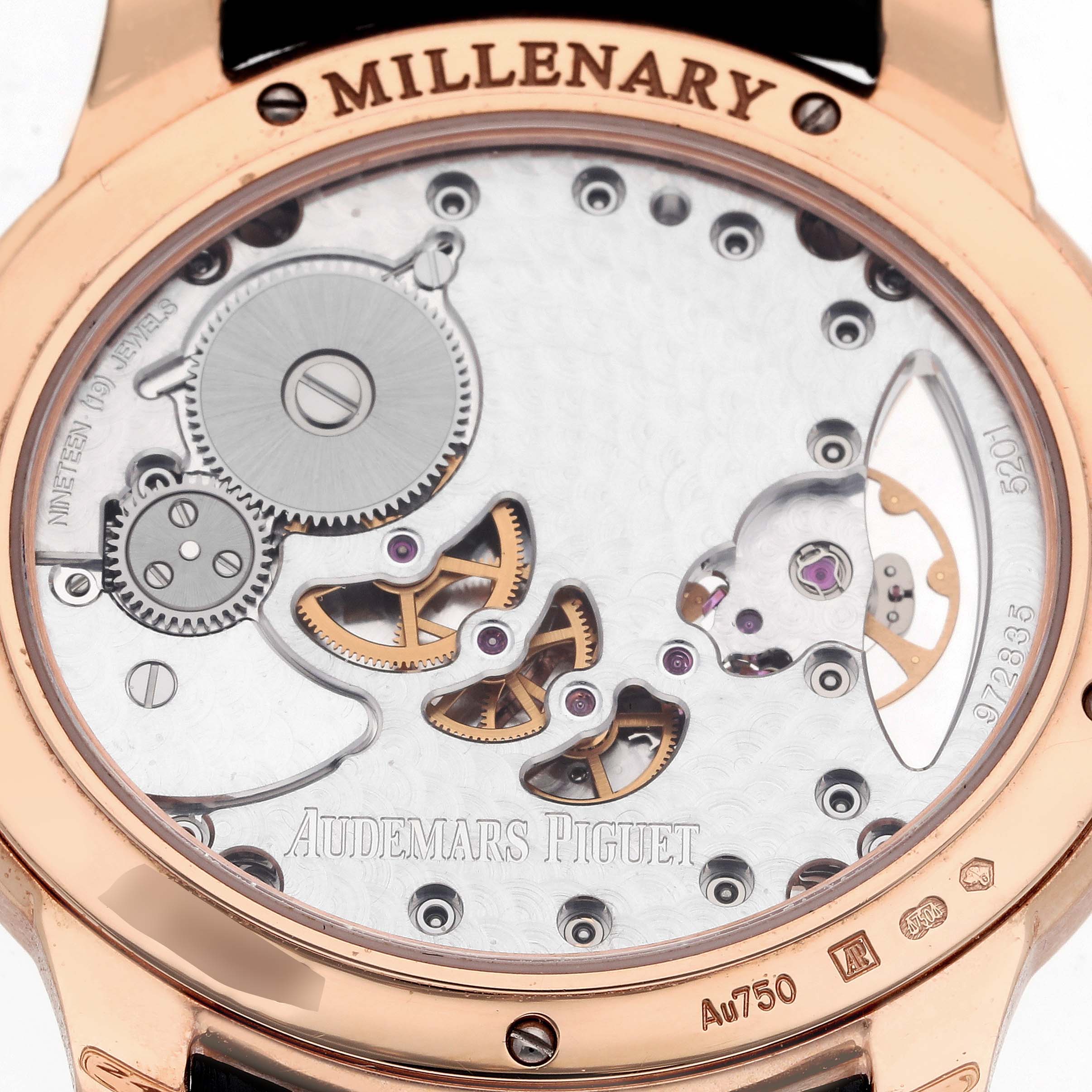The image shows the back view of the Audemars Piguet Millenary 77247OR Women's Rose Gold Mother of Pearl Dial 77247OR Women's Rose Gold Mother of Pearl Dial watch, highlighting its movement and intricate components.