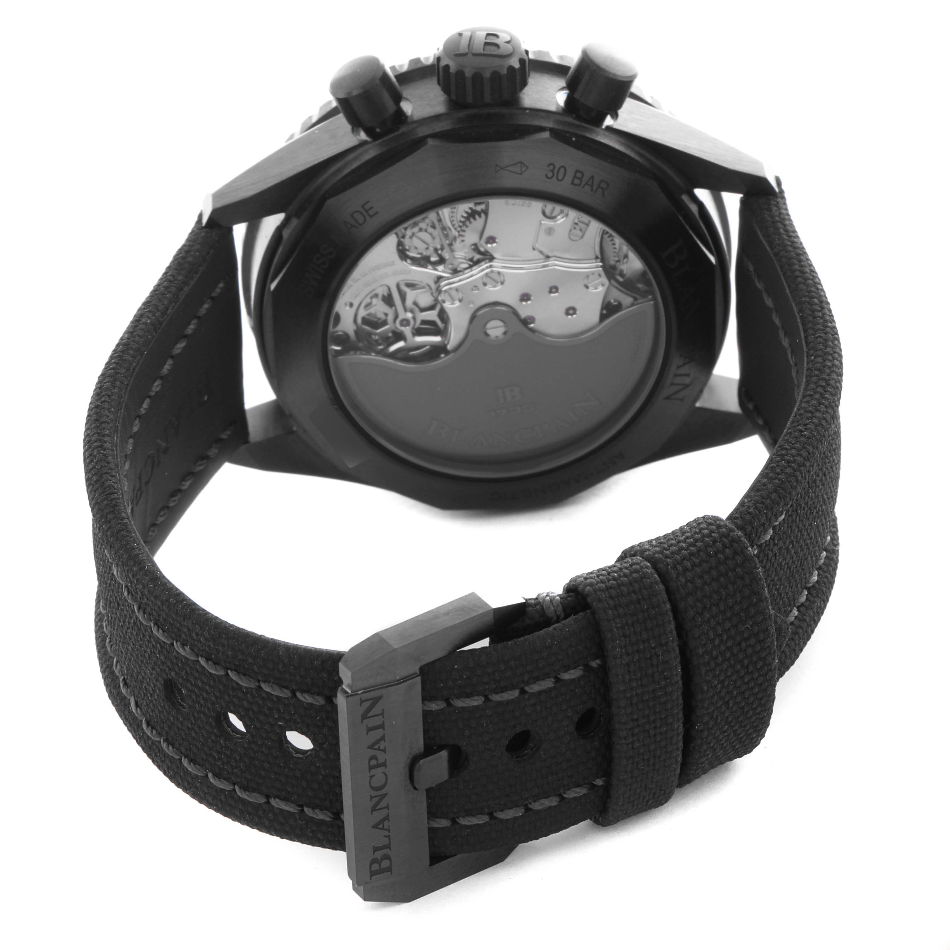 The Blancpain Fifty Fathoms 5200-0153-B52A Men's Ceramic Green Dial 5200-0153-B52A Men's Ceramic Green Dial watch is shown from the back, displaying the movement and the strap with a visible buckle.