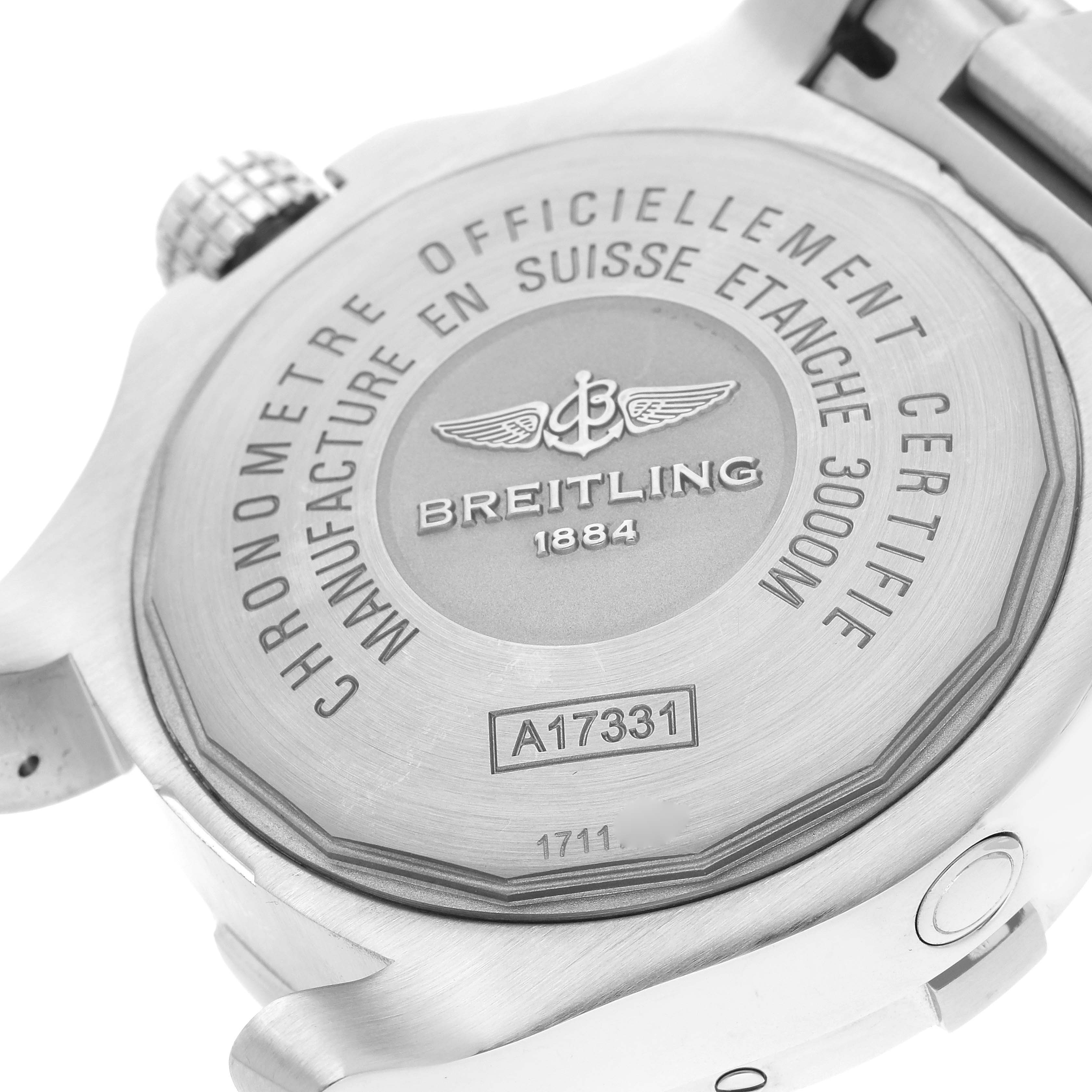 The image shows the back case of a Breitling Avenger A17331 Men's Stainless Steel Black Dial A17331 Men's Stainless Steel Black Dial watch, highlighting its engravings and crown.