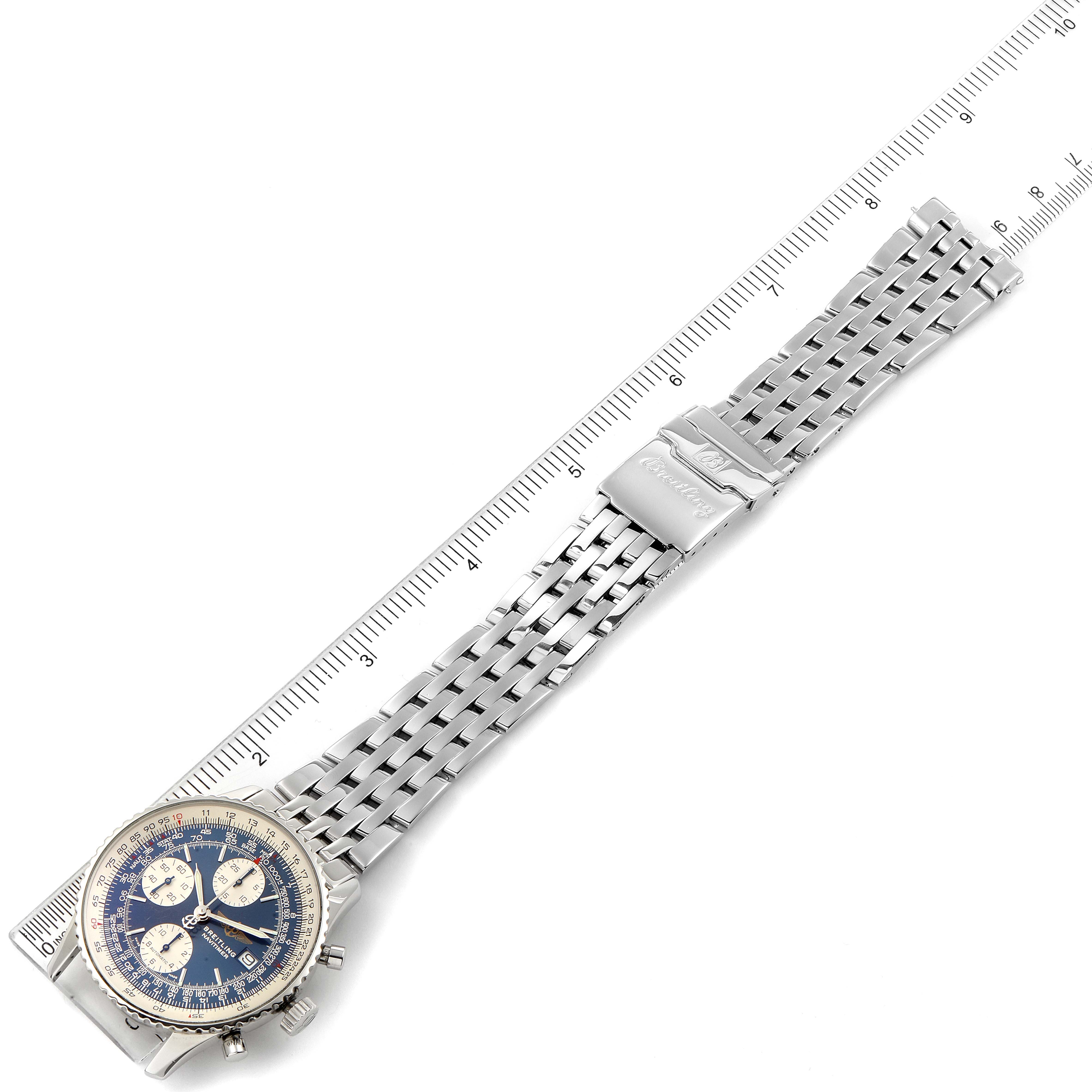 The image shows a Breitling Navitimer A13322 Men's Stainless Steel Blue Dial A13322 Men's Stainless Steel Blue Dial watch flat, highlighting its face, metal bracelet, and clasp, with a ruler for scale.