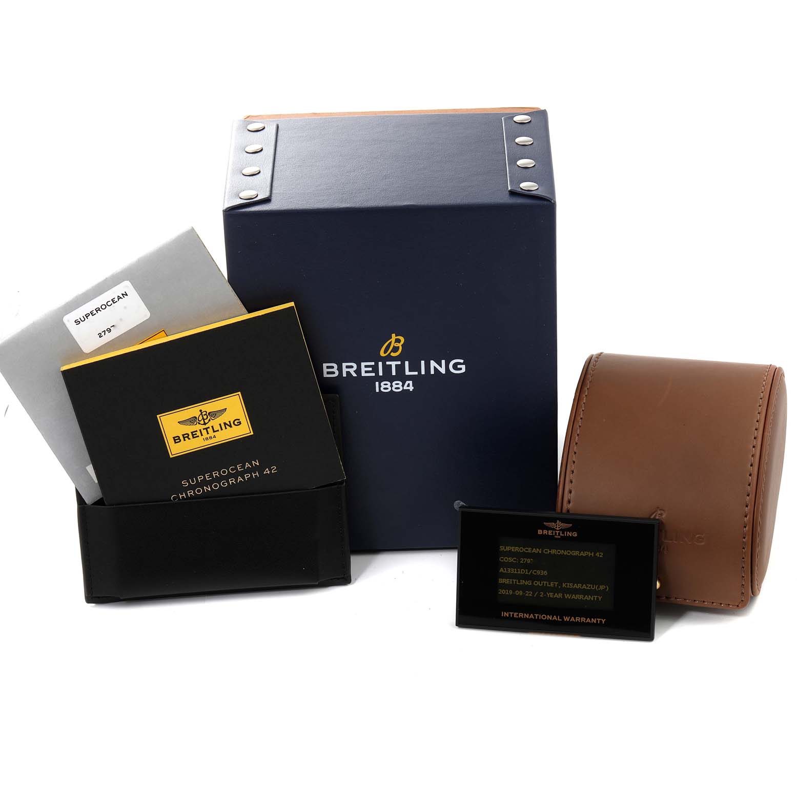 This image shows the box, warranty card, and leather watch case for a Breitling Superocean A13311 Men's Stainless Steel Blue Dial A13311 Men's Stainless Steel Blue Dial Chronograph 42.
