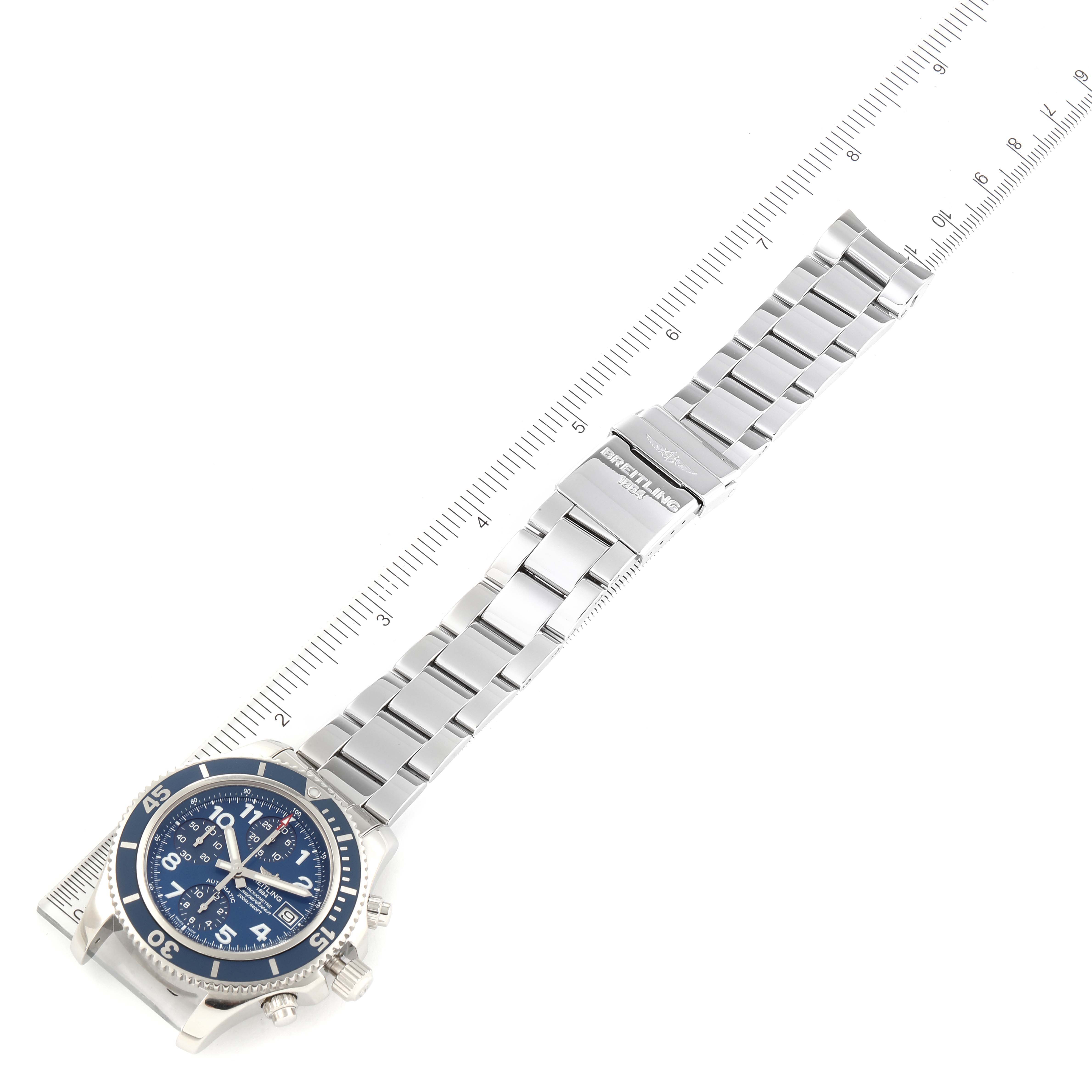 The image shows a Breitling Superocean A13311 Men's Stainless Steel Blue Dial A13311 Men's Stainless Steel Blue Dial watch with a full view of the stainless steel bracelet and a measuring ruler for scale.