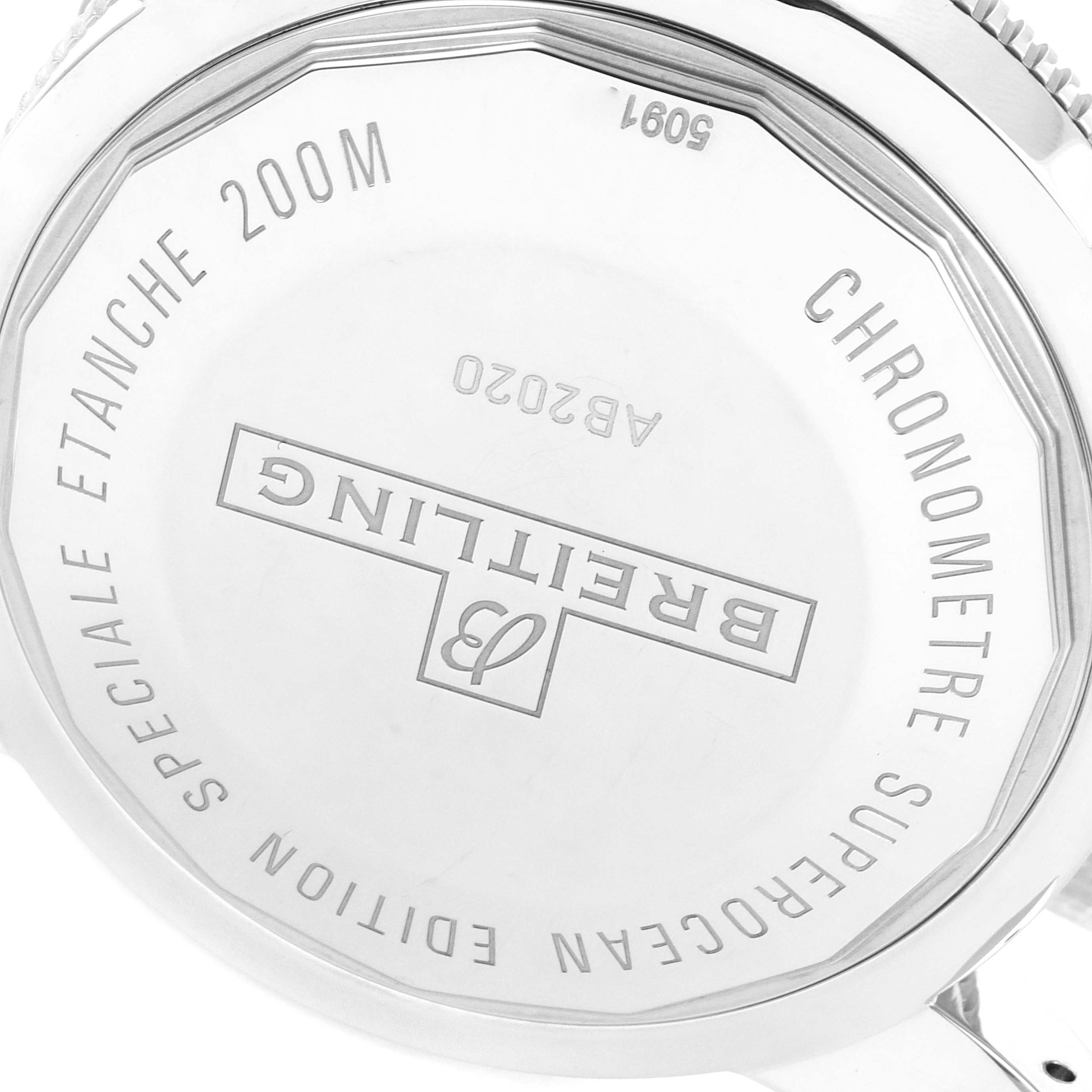 The image shows the back case of a Breitling Superocean AB2020 Men's Stainless Steel Blue Dial AB2020 Men's Stainless Steel Blue Dial watch, featuring engraving details.