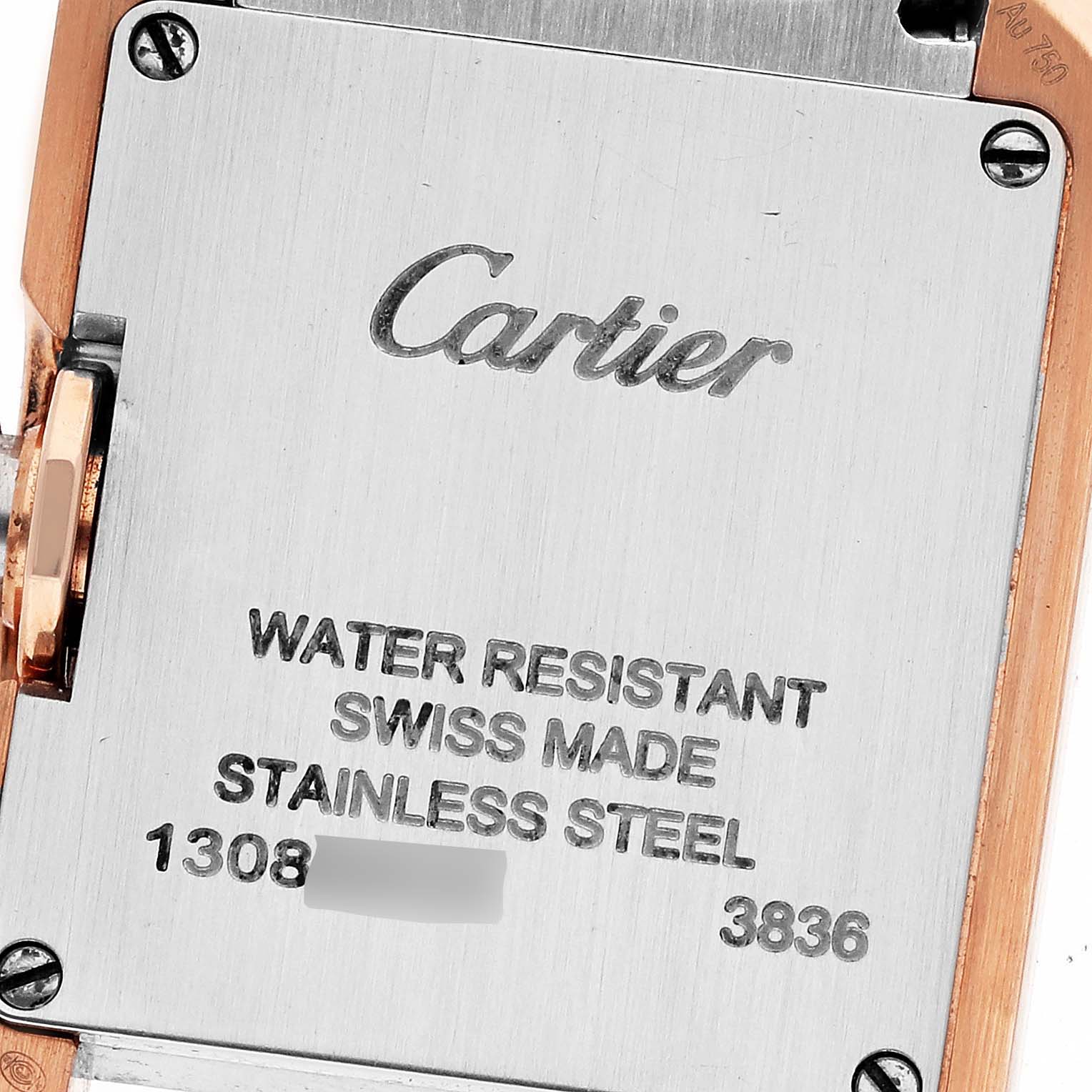 The image shows the back of a Cartier Tank Anglaise W3TA0002 Women's Steel and Gold (two tone) Silver Dial W3TA0002 Women's Steel and Gold (two tone) Silver Dial watch, highlighting the brand logo and specifications.