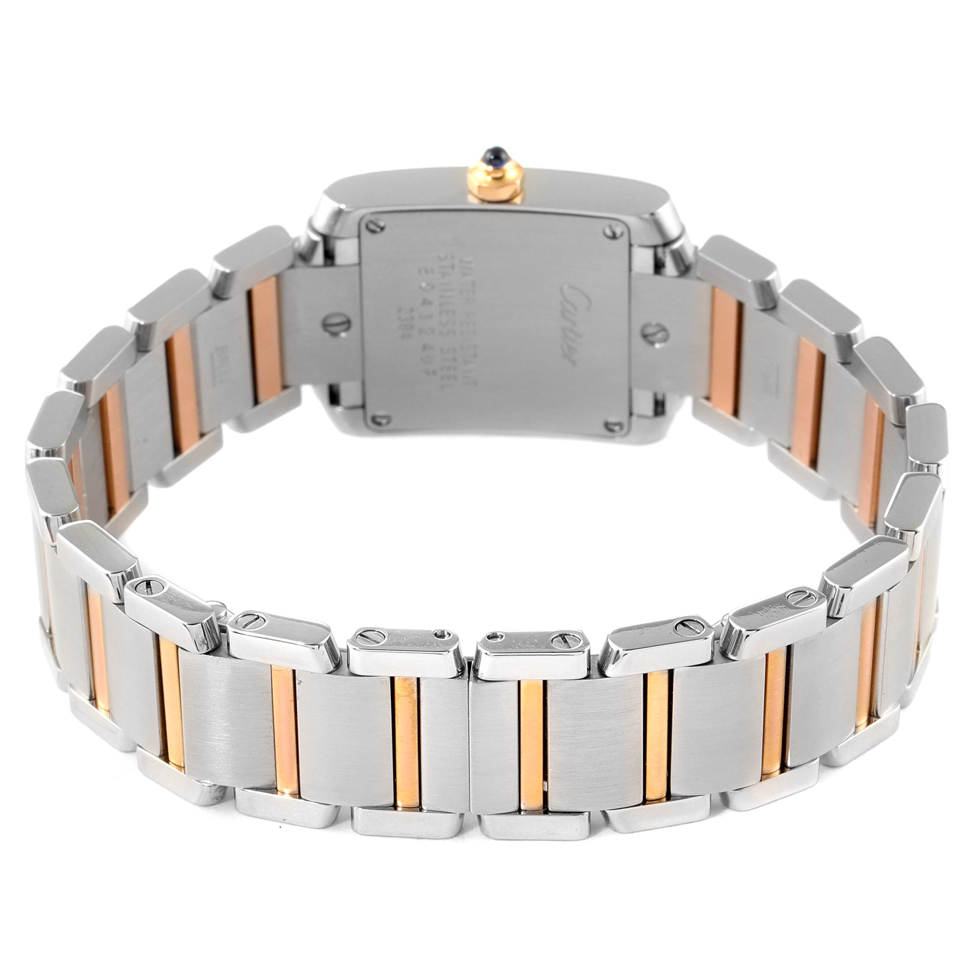 The image shows the back case and half-opened bracelet of a Cartier Tank Francaise W51027Q4 Women's Steel and Gold (two tone) Mother of Pearl Dial W51027Q4 Women's Steel and Gold (two tone) Mother of Pearl Dial watch, highlighting its two-tone metal design.