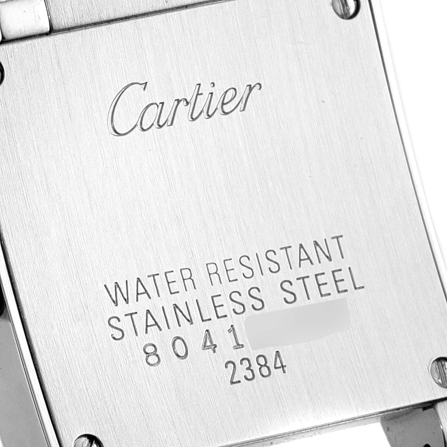 The image shows the backplate of a Cartier Tank Francaise W51027Q4 Women's Steel and Gold (two tone) Mother of Pearl Dial W51027Q4 Women's Steel and Gold (two tone) Mother of Pearl Dial watch, highlighting its water resistance and stainless steel construction.