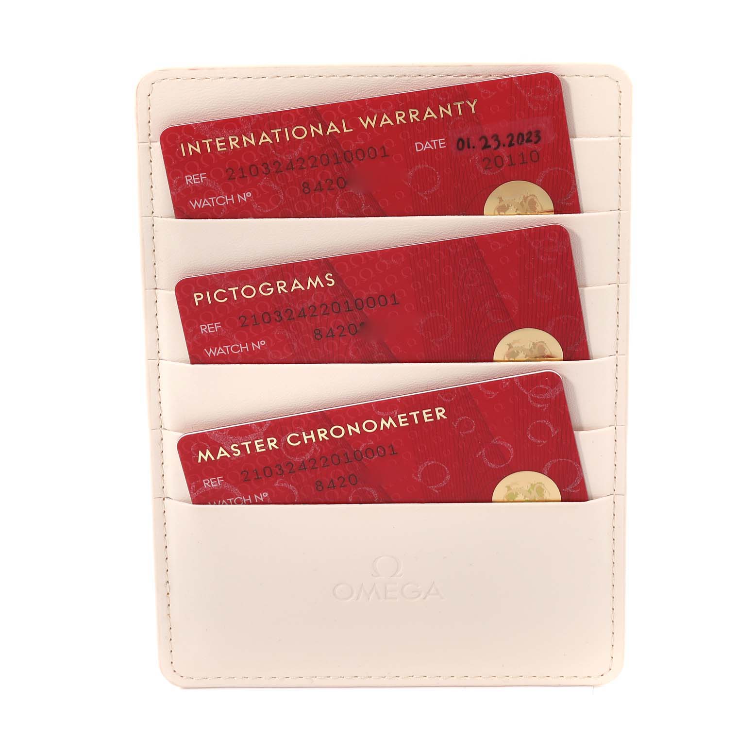 This image shows three official cards—International Warranty, Pictograms, and Master Chronometer—of an Omega Seamaster 210.32.42.20.10.001 Men's Stainless Steel Green Dial 210.32.42.20.10.001 Men's Stainless Steel Green Dial, placed inside a white cardholder.