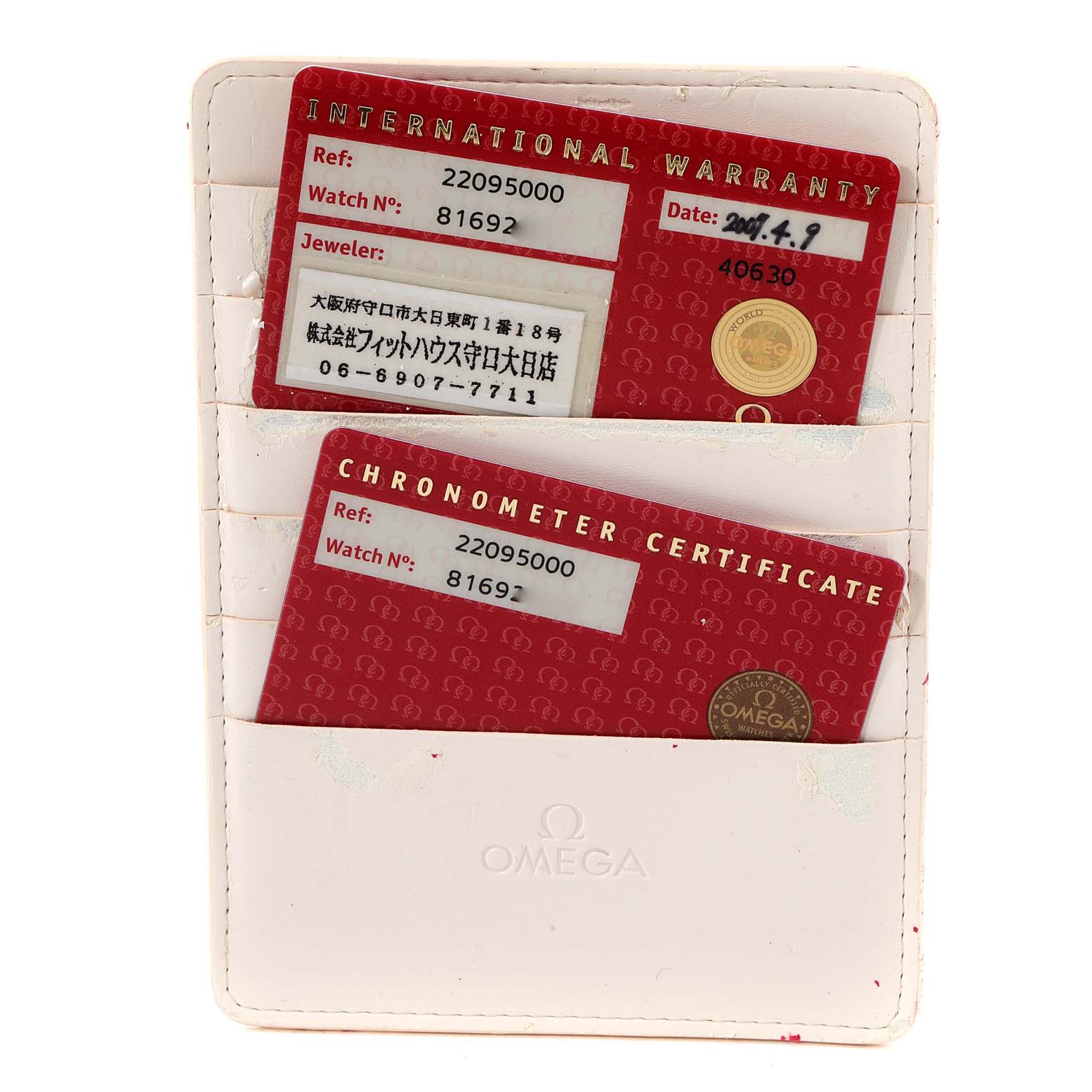 The image shows a top view of Omega Planet Ocean 2209.50.00 Men
s Stainless Steel Black Dial 2209.50.00 Men
s Stainless Steel Black Dial watch
s international warranty and chronometer certificate cards in a white holder.